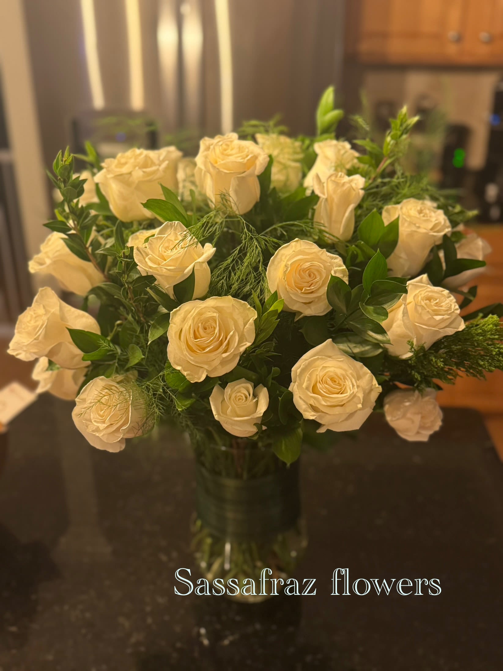 Pure love - beautiful premium roses all 30 perfectly placed with astralian evergreen shrub (wax flower) isreali ruskus in a tall vase.