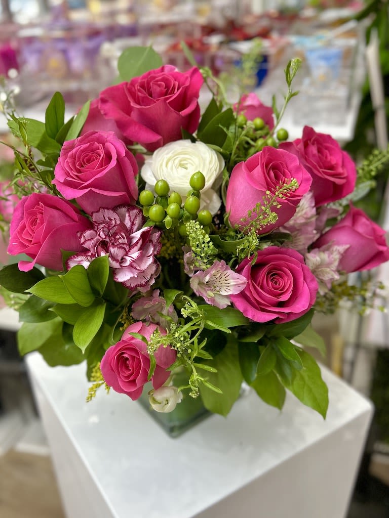 Thinking of You Bouquet - Hot Pink Roses - Nice and Cute flower composition of flowers placed in a cube crystal vase 5x5 accented with roses, ruscus, greens, and lilies
