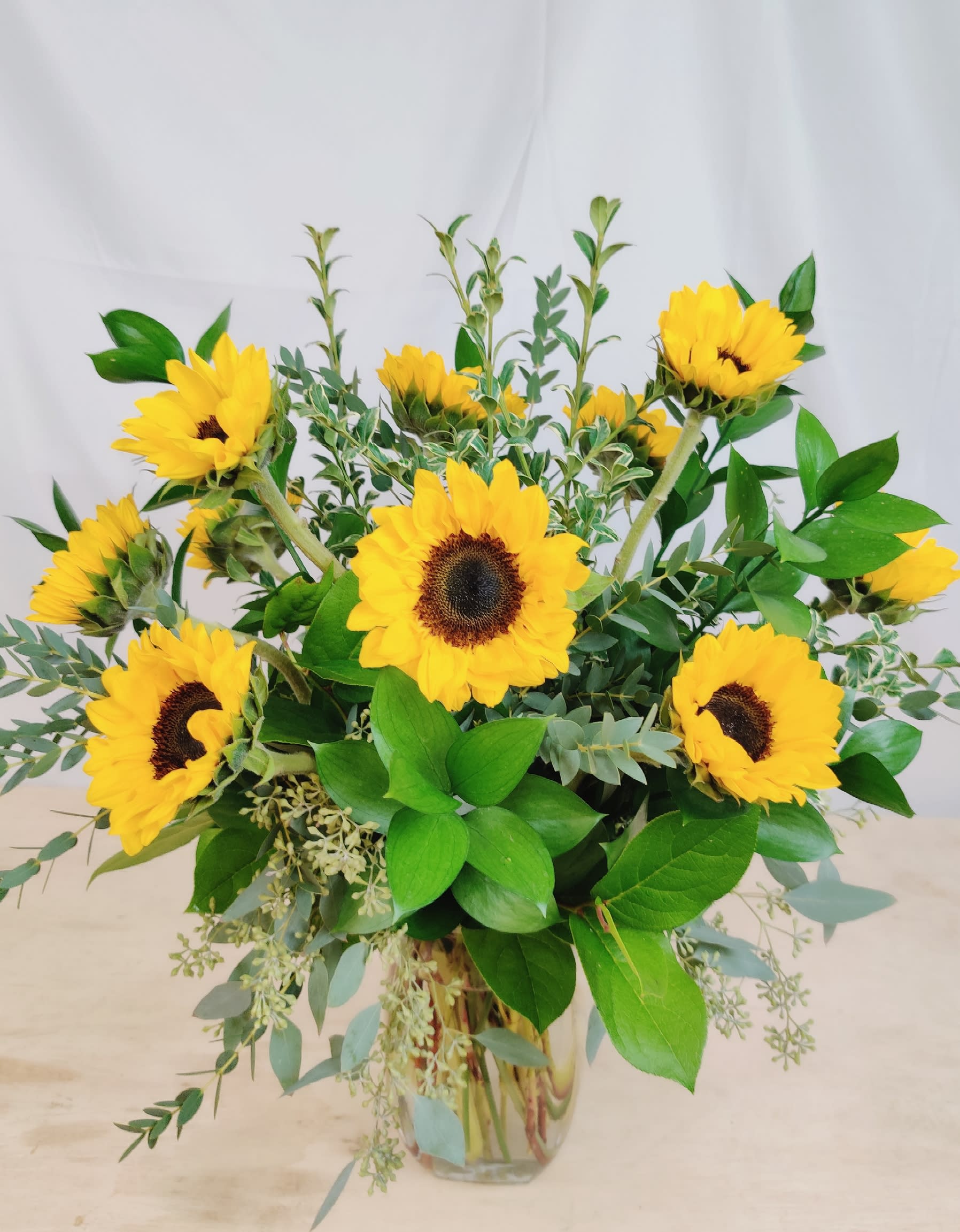 The Country Sunflower - Happy sunflowers...perfect for the lover of sunflowers or just to make someone smile. Fresh sunflowers with beautiful assorted seasonal foliage  