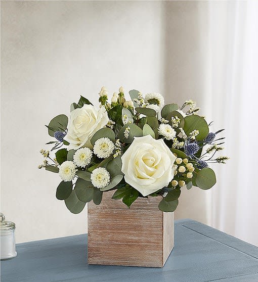 Country Pearl - White roses, thistle blue,white limonium, white button pom,cream hypericum, succulent, eucalyptus silver dollar.