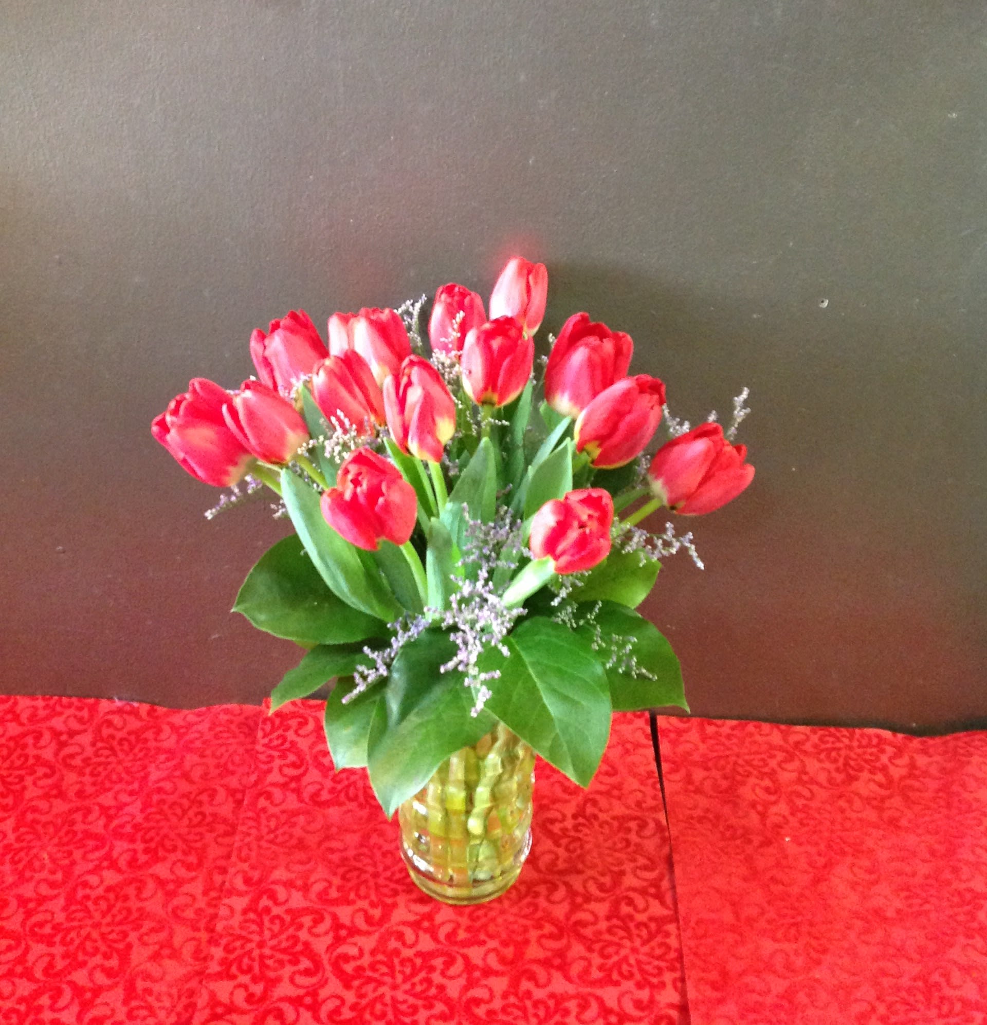 Tulip Vase - A beautiful simple vase of tulips, fillers, and greens. Colors will vary based on availability, and we will do our best to fill color requests.  