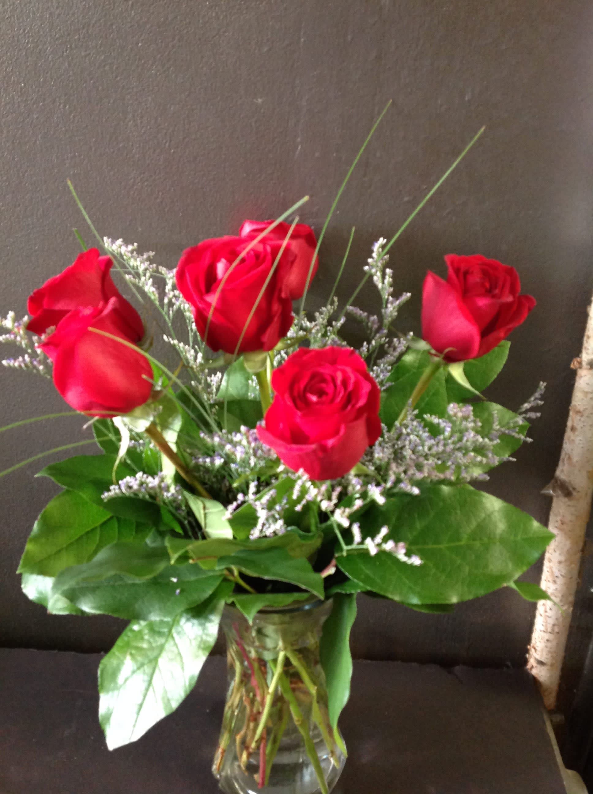 Half Dozen Rose Vase - A vase with 6 roses with greens and asst fillers.  They will be red as the default, you may request another color but we can not guarantee it and will use red if requested color is unavailable.  Available February 9-14 