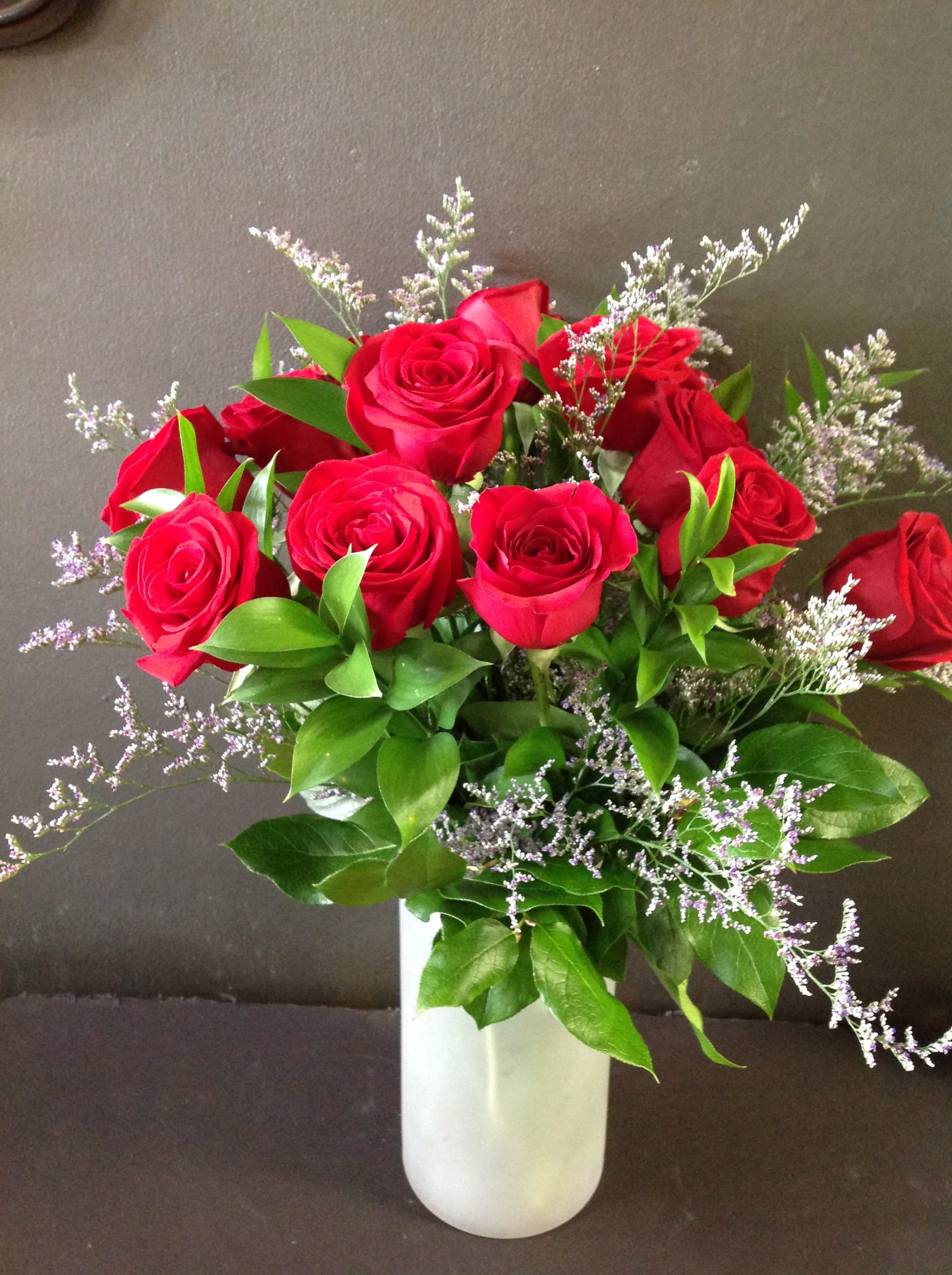 Dozen Red Roses - Long stemmed red rose vase with greens.  We will try to substitute another color rose upon request if available.  Available February 9 - February 14.