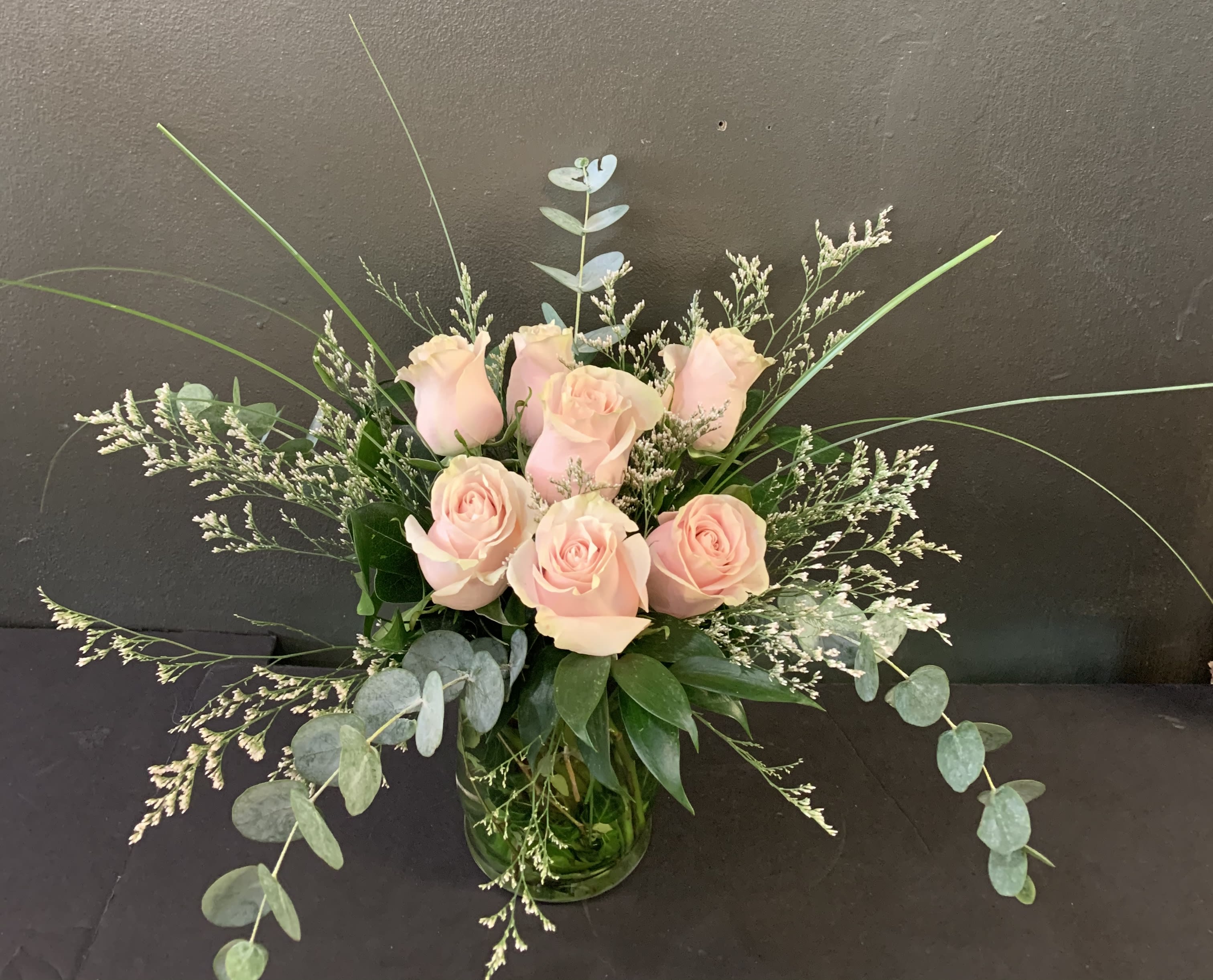 Daydreaming - Blush roses with a variety of greenery and eucalyptus come together for a lovely arrangement. A stylish and sweet way to dress up any space.   Available February 9 - 14.