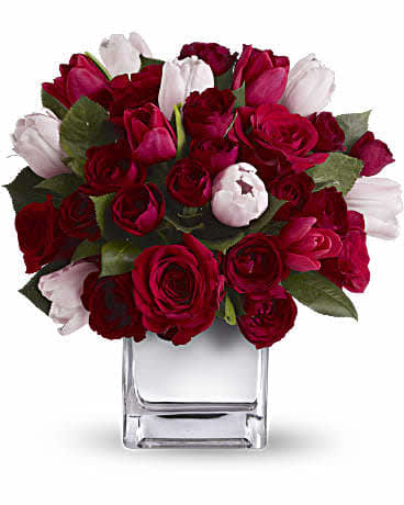 Valentine  Wishes - This deluxe, heartfelt arrangement puts a feminine spin on classic red roses by mixing in elegant red and pink tulips. Presented in our modern Mirrored Silver Cube,