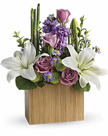 Ultimate bliss bouquet -   This bouquet lavender roses, white asiatic lilies, lavender stock, monte cassino asters and green chrysanthemums, accented with fresh greenery. 