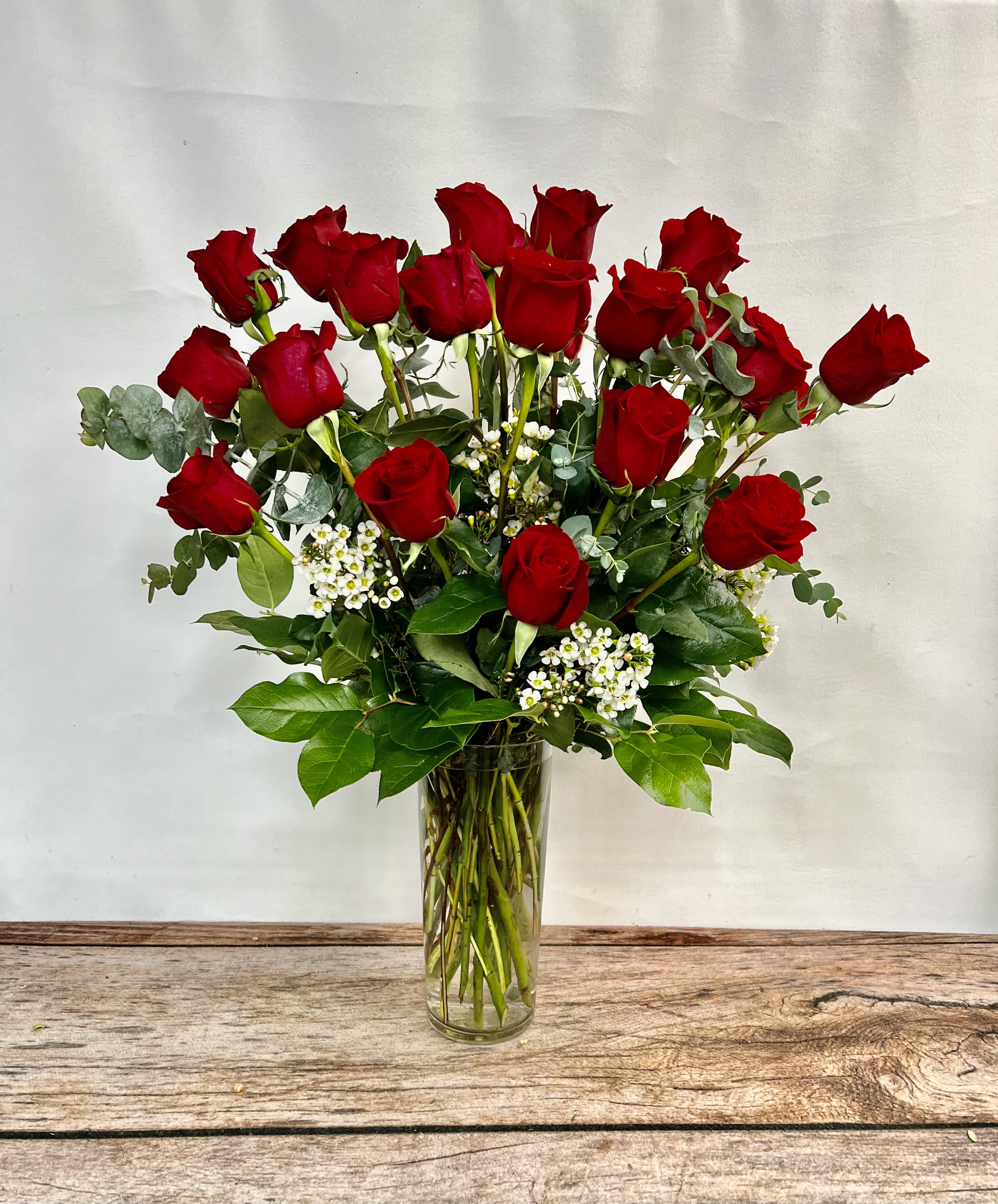 Valentine's  Long Stem Two Dozen Roses - Two dozen long stem red roses traditionally designed in a vase.  If you prefer an alternate color, please request in the special instruction field.