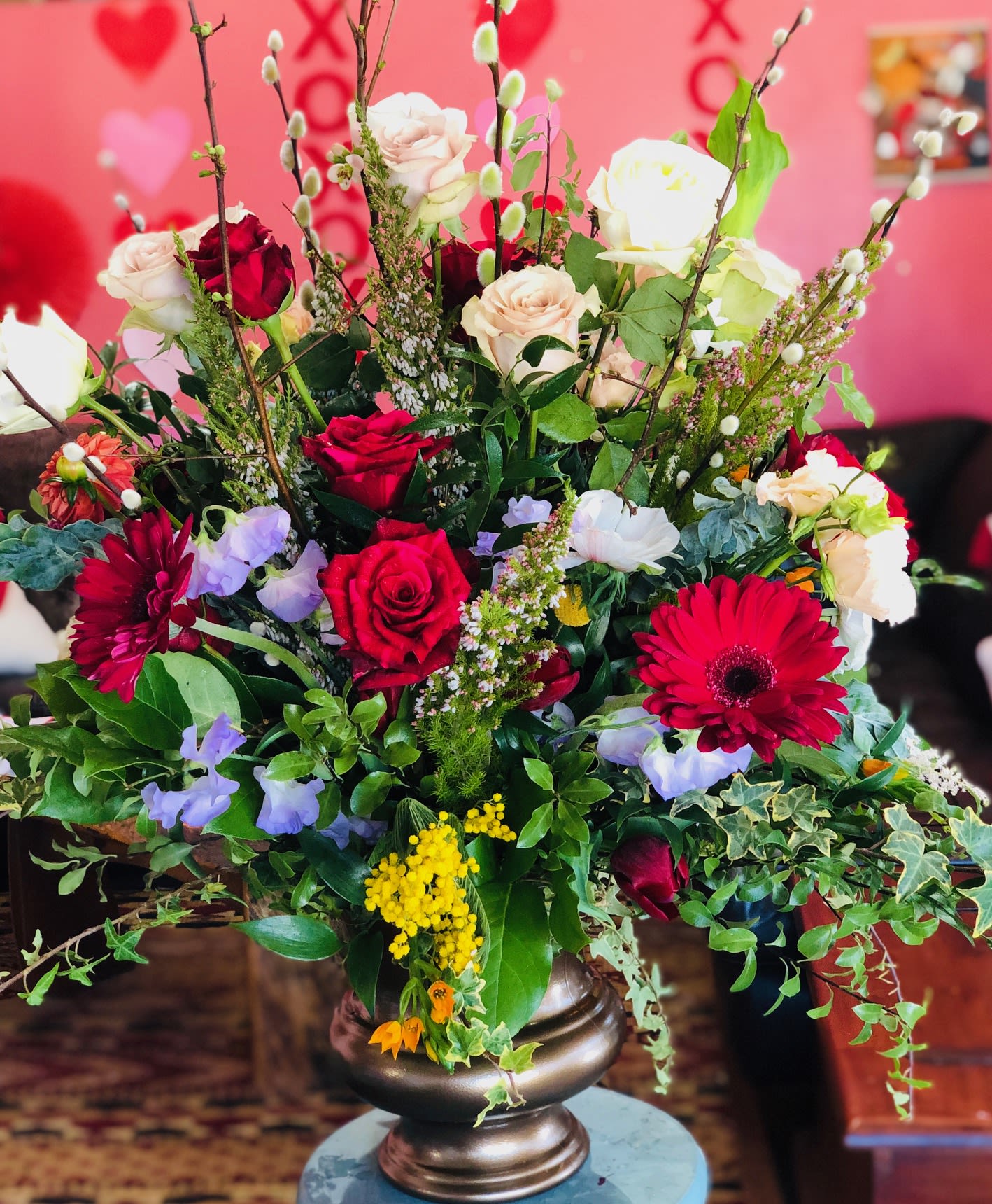Living on the Wild Side ***ONLY AVAILABLE FOR THE WEEK OF VALENTINE'S*** - Wow your person! A plethora of roses, garden roses, seasonal flowers mimicking a wild and beautiful garden. Colors can also be customized. Large arrangement appropriate for the foyer or entryway.