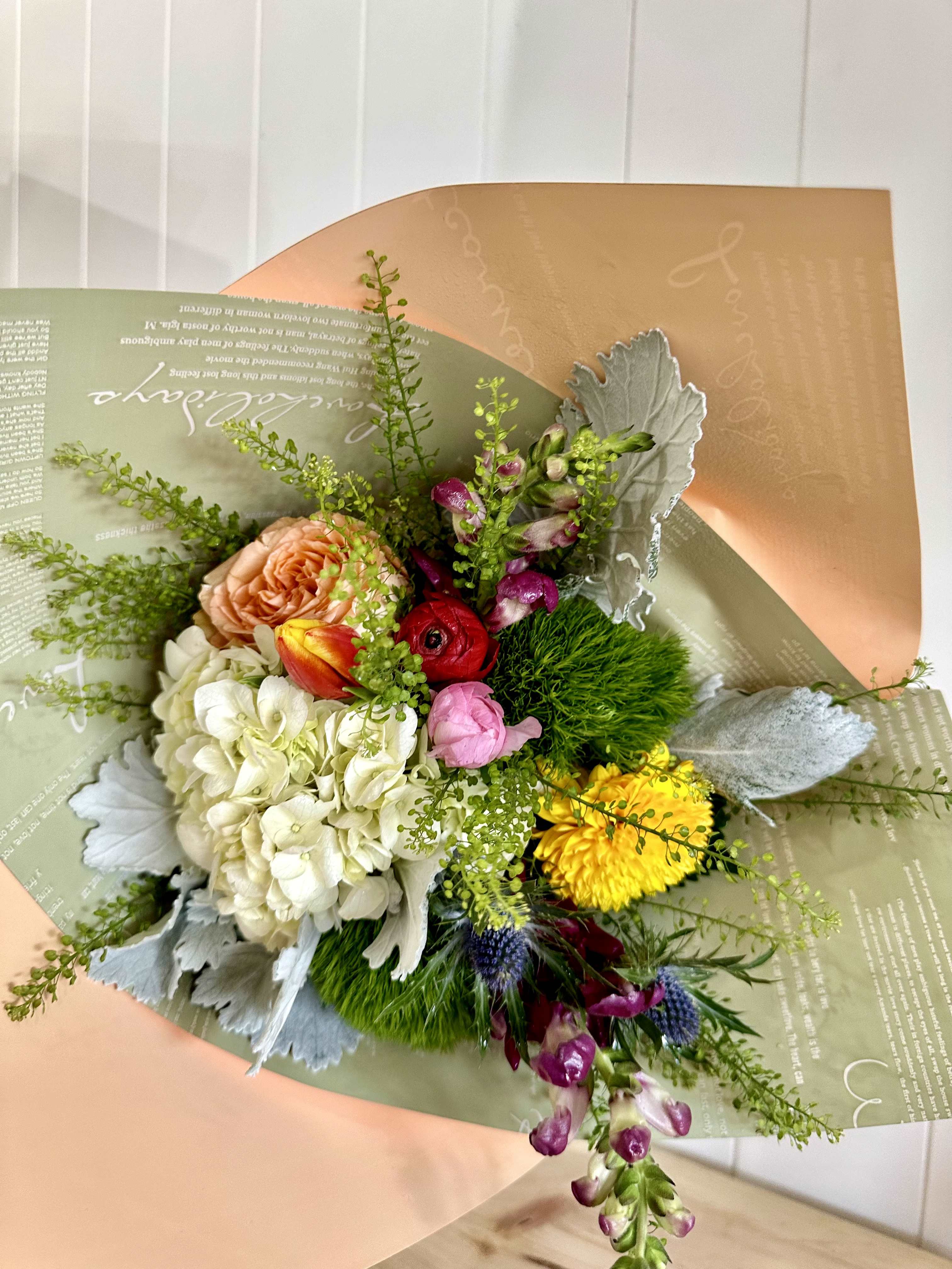 The Market Bouquet - A beautiful mix of seasonal flowers wrapped and tied for the perfect presentation for your special occasion.  *vase not included