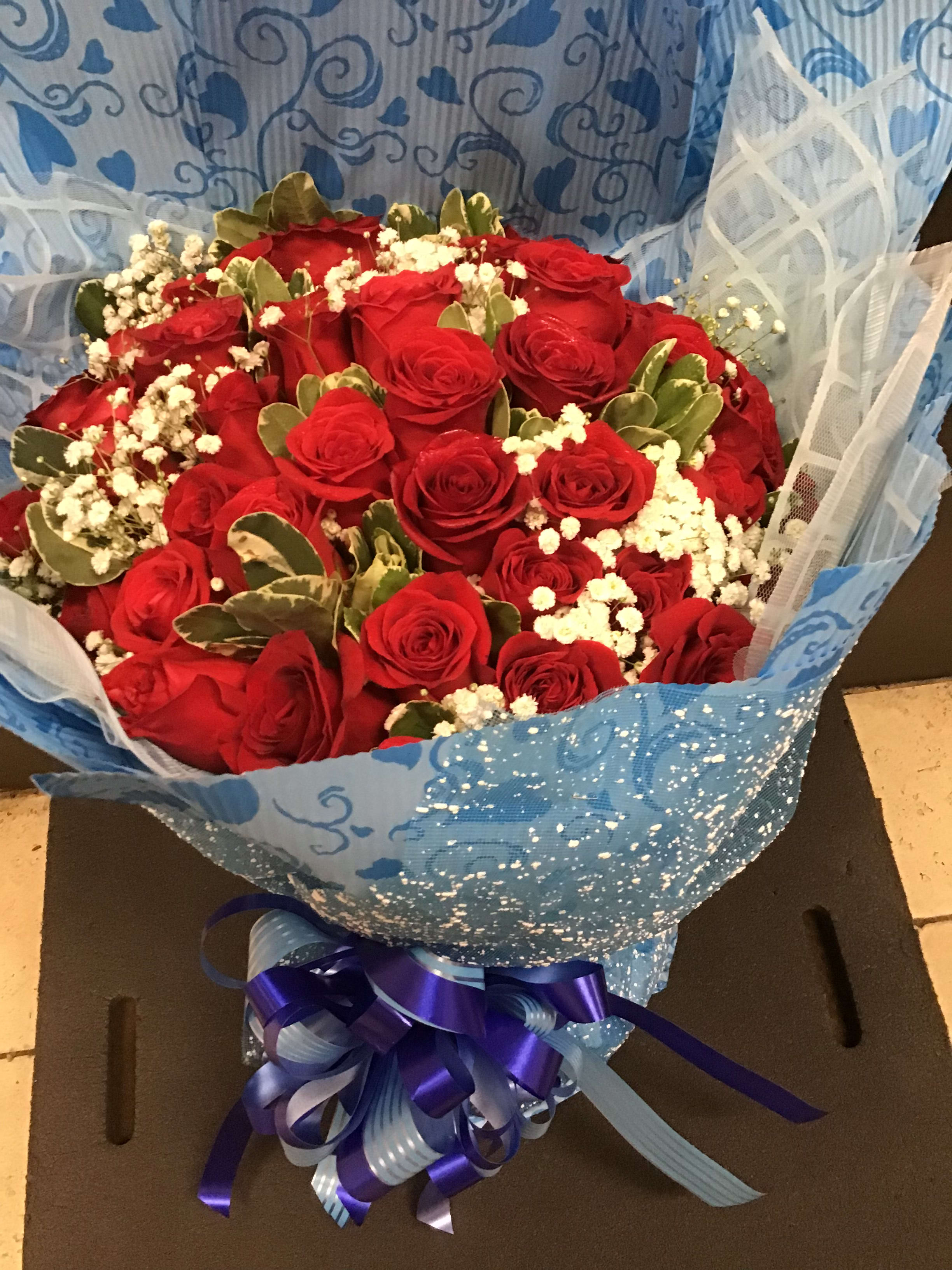 special  Warping (BQ28)  - 3 Dozen red roses with baby's breath wrapping in a blue craft paper , make her say wow 