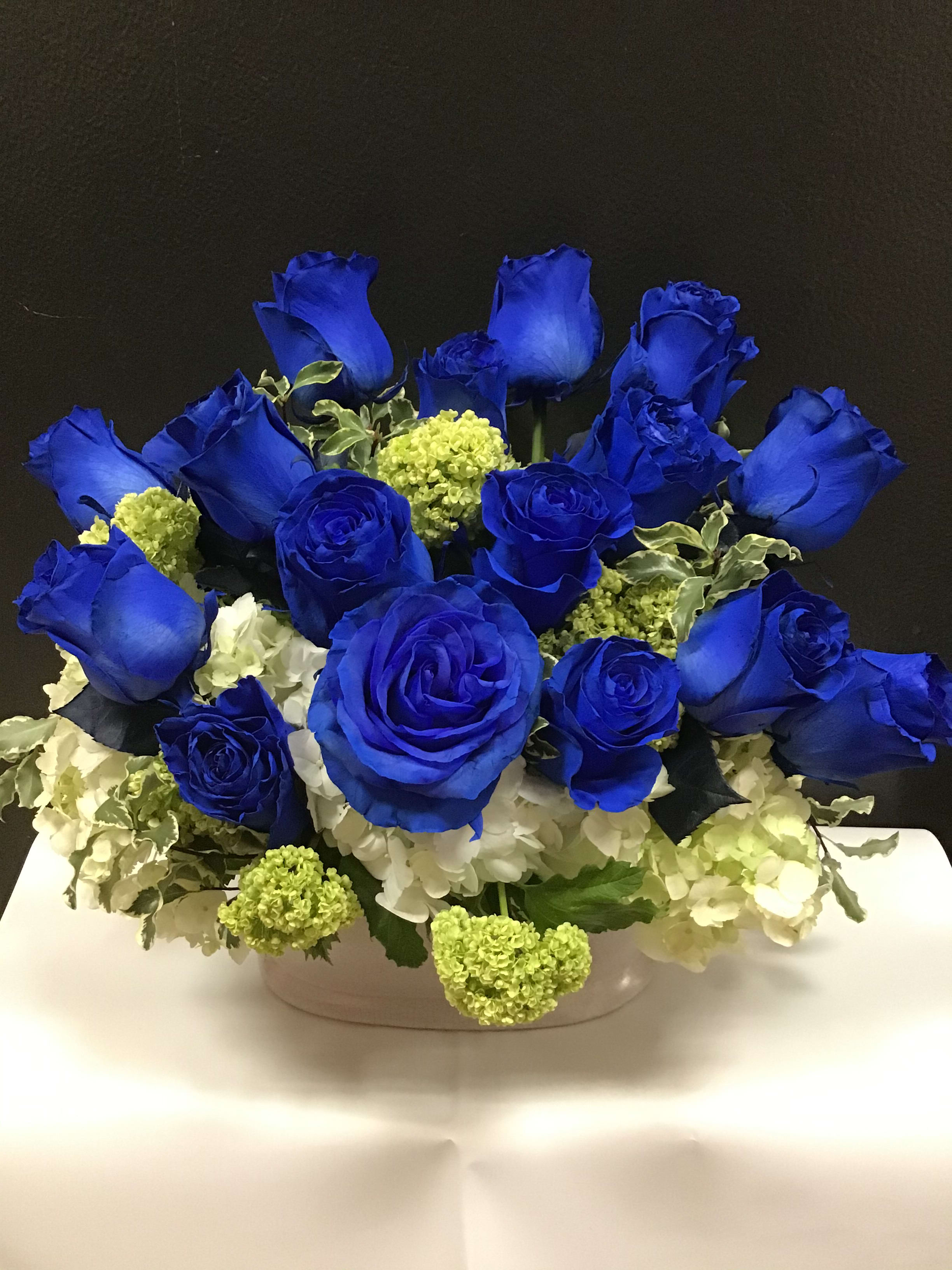 Blue Lover  - This beautiful arrangement made with blue roses , white and white hydrangea in a white ceramic container. 