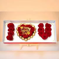 I LOVE YOU, Signature Box - A breathtaking luxury presentation spelling LOVE with premium red roses, centered by a heart-shaped arrangement surrounded by decadent Ferrero Rocher chocolates. Designed inside a refined keepsake box with gold accents, LOVE, Always is a grand declaration of romance and devotion.
