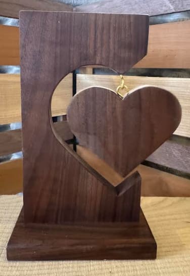 Hanging Heart Wooden Decor2 - Handcrafted from quality wood, this wooden heart piece features a deep rich color that highlights the natural grain of the wood.  Each piece is carefully crafted, making every piece truly one of a kind. Approximate size 10" tall x 6" wide
