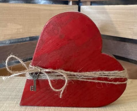 Key To My Heart3 - This charming wooden heart is wrapped in rustic twine and finished with a decorative key.  Each piece is carefully crafted, making every piece truly one of a kind.  Approximate size 7" x 6 1/2"