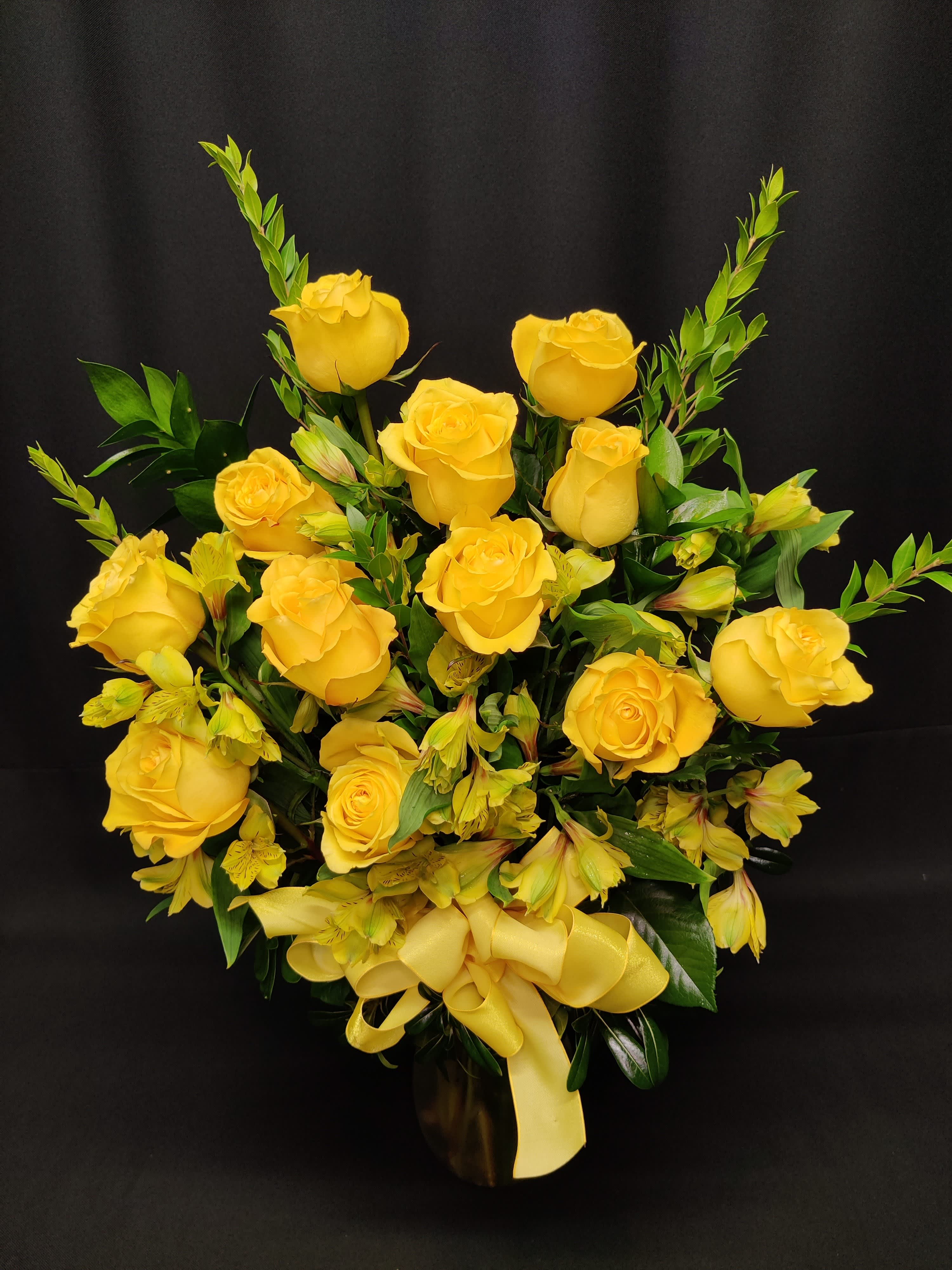 SALE Premium dozen long stem Yellow roses - Read description - While supplies last, enjoy a dozen at a reduced rate! Long lasting roses- our biggest and best long stem roses by the way, along with filler flowers in a vase; send this arrangement to your sweetie's work, and it will be the talk of the office.  Colors cannot be guaranteed so order ahead and send us alternates. Yellow color cannot be guaranteed with less than 1 week notice / 3 week's prior to Valentine's day. If a color must be substituted we will email you. Please reply quickly or we may opt to cancel the order.  Our premium dozen includes filler flowers, lush greenery a ribbon clutch or bow and quality vase. Vase and accent flowers may vary.   We deliver our vased roses completely arranged so there is no fuss to find scissors. All of this is included; there are no hidden costs for the best, most perfect roses you will find.  Our rose arrangements are so fresh, we don't arrange them until you order them. If you want the best for your sweetheart, order ahead!  Because each arrangement is custom made, no two are exactly alike and yours may differ slightly from photo.