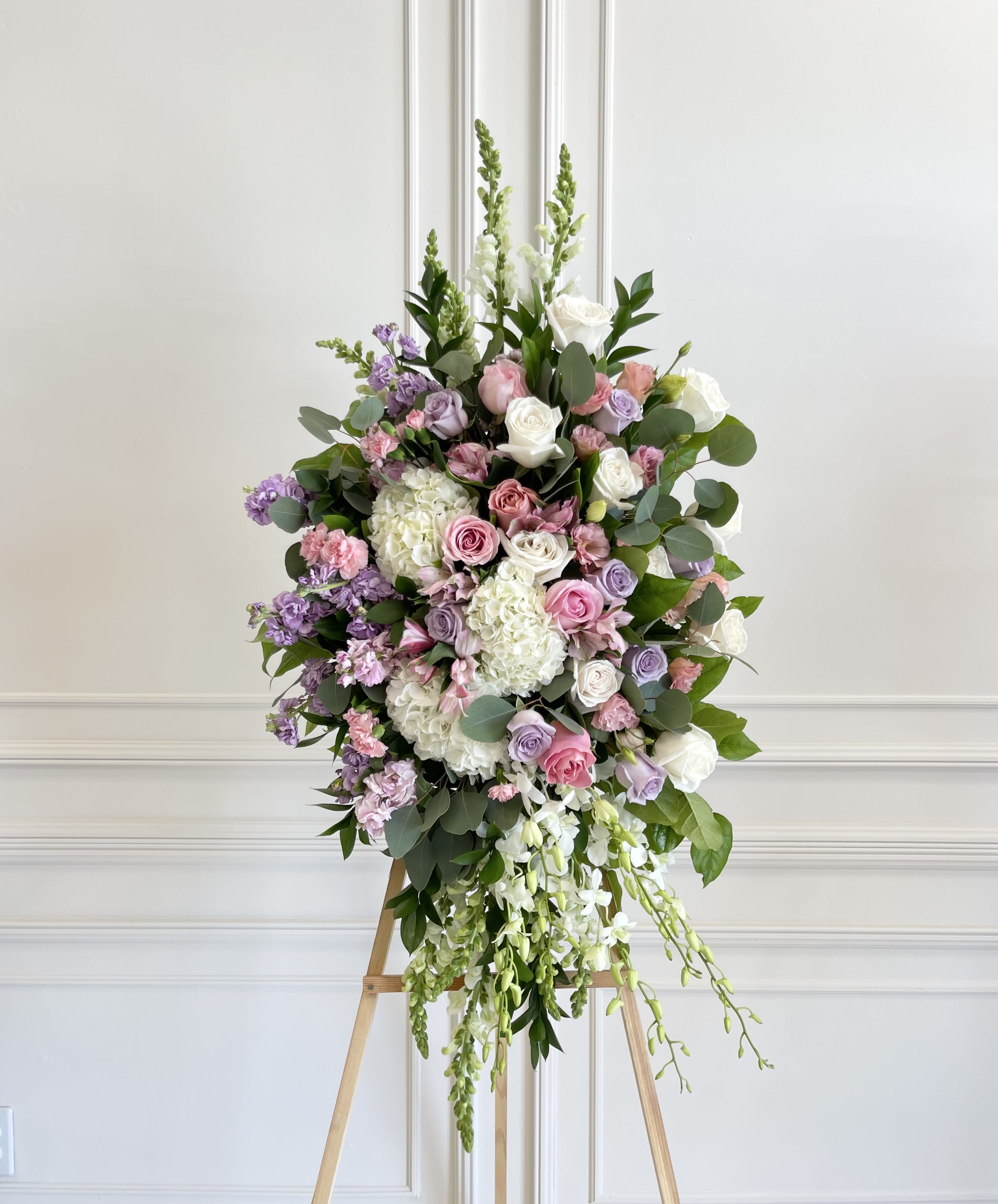 Pink and lavender spray  - Orchids  Hydrangeas Roses  Snapdragon  Stock  Mini carnations  Coin eucalyptus Lisianthus       