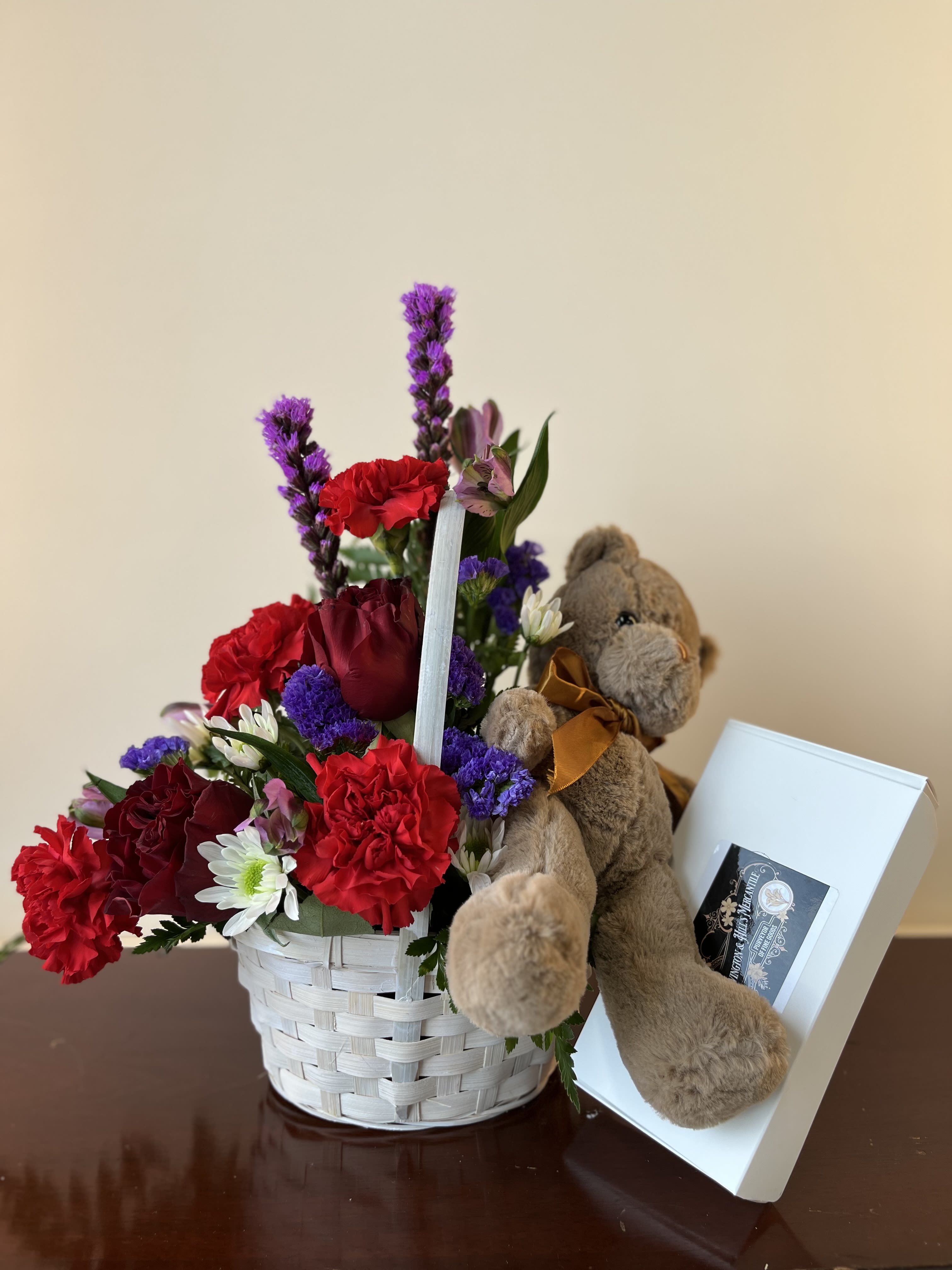 S&amp;H'S I LUV U Bouquet - A seasonal mix of flowers gathered in a basket with an adorable teddy bear and a box of chocolates for your sweetie.
