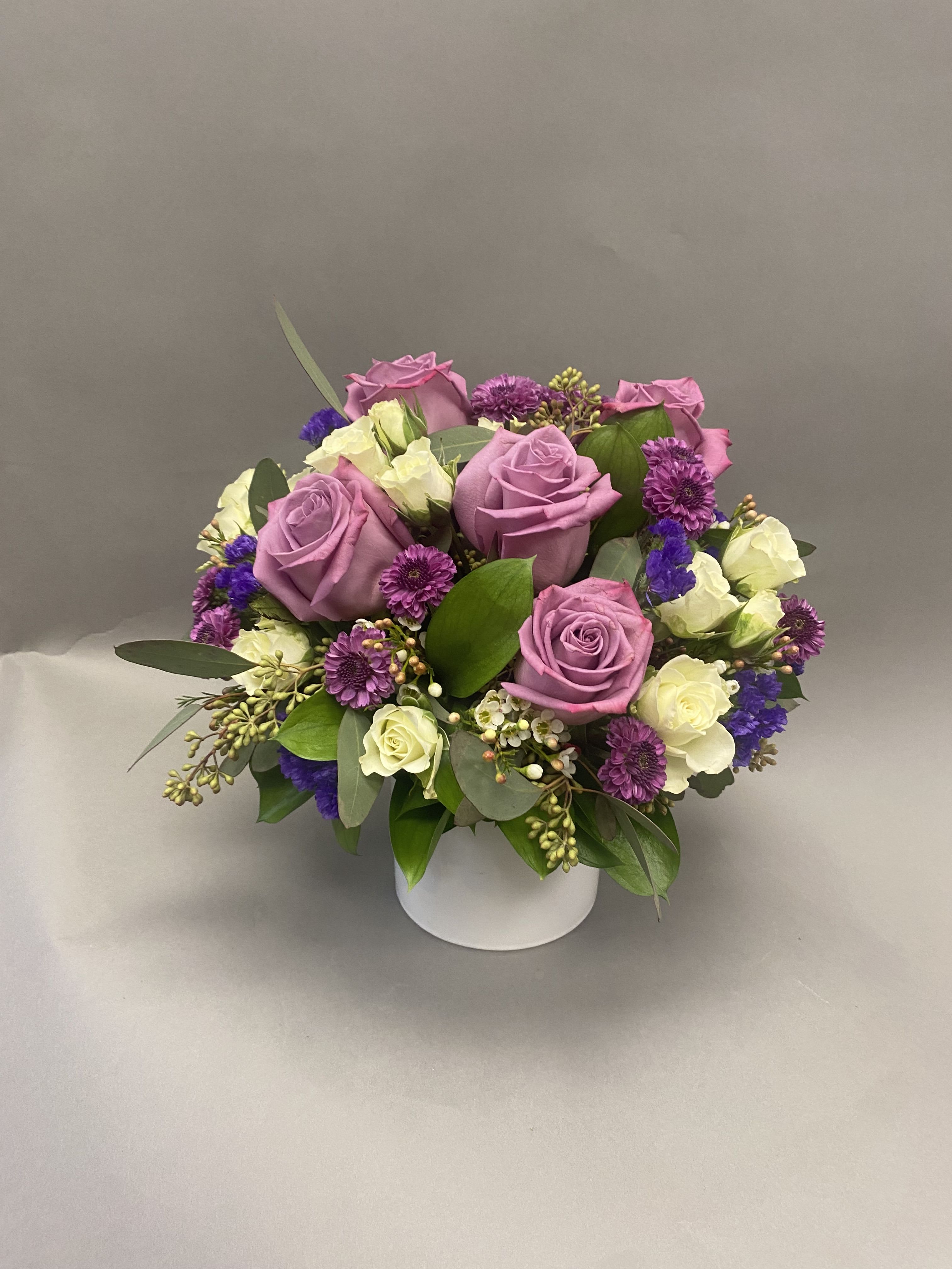 Lavender Margarita  - Lavender seasonal flowers in a small lavender glass vase. Perfect for any occasion. 