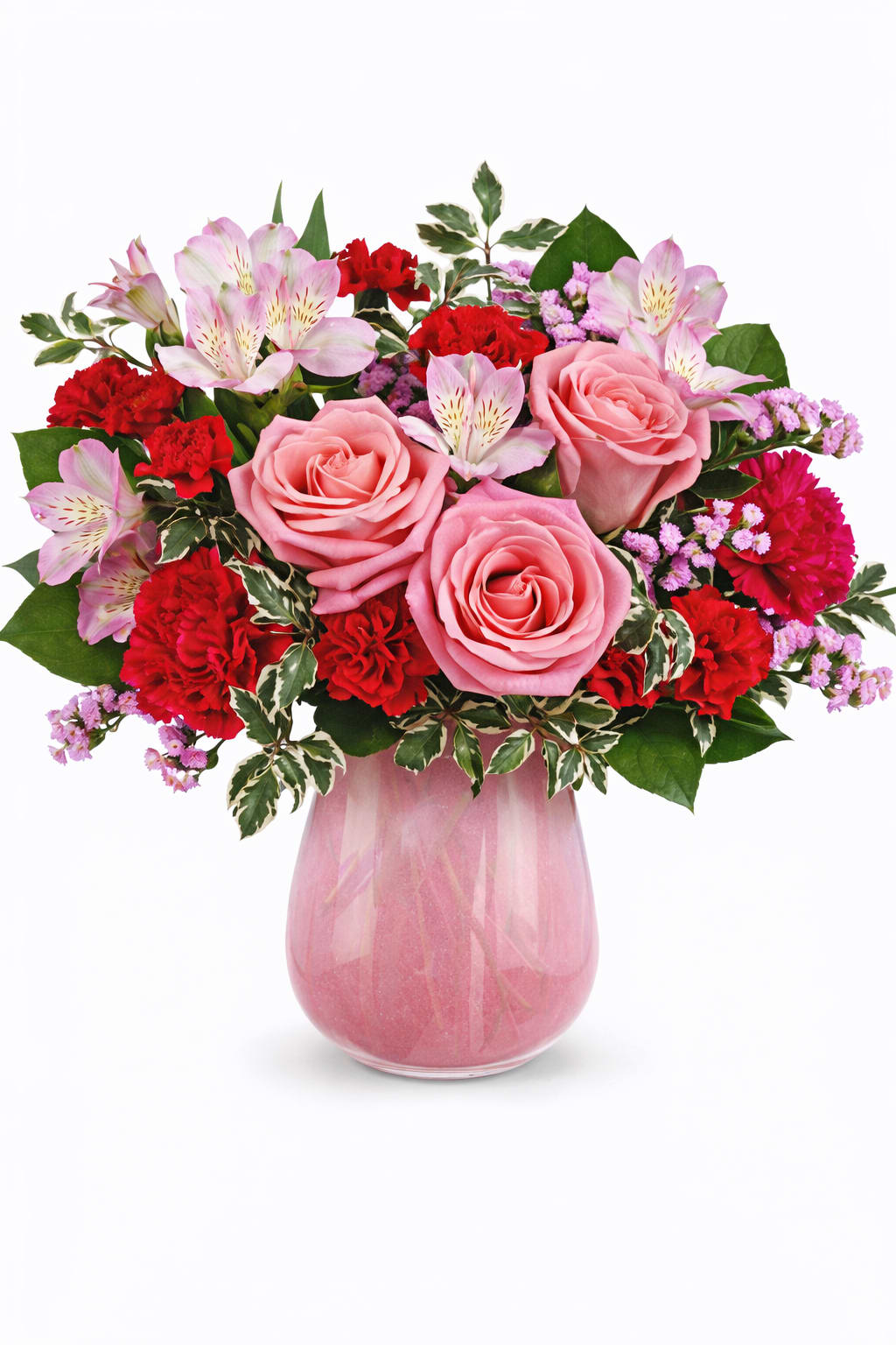 Sweet On Hue Bouquet - Pink &amp; Red Floral Arrangement in a Pink Glass Vase  This charming floral arrangement features a beautiful mix of soft pink roses, vibrant red carnations, delicate pink alstroemeria, and airy pink accent flowers, all thoughtfully arranged with fresh greenery in a blush pink glass vase. The blend of pink and red tones symbolizes love, admiration, and heartfelt emotion, making this arrangement both elegant and expressive.  Perfect for Valentine’s Day, anniversaries, birthdays, Mother’s Day, or romantic gestures, this mixed flower arrangement adds warmth and beauty to any home or office. Designed by our professional florists using fresh, seasonal blooms, it offers a lush, balanced presentation with lasting appeal.  Available for local flower delivery and same-day delivery when available, this pink and red floral arrangement is a thoughtful way to celebrate love and meaningful moments.