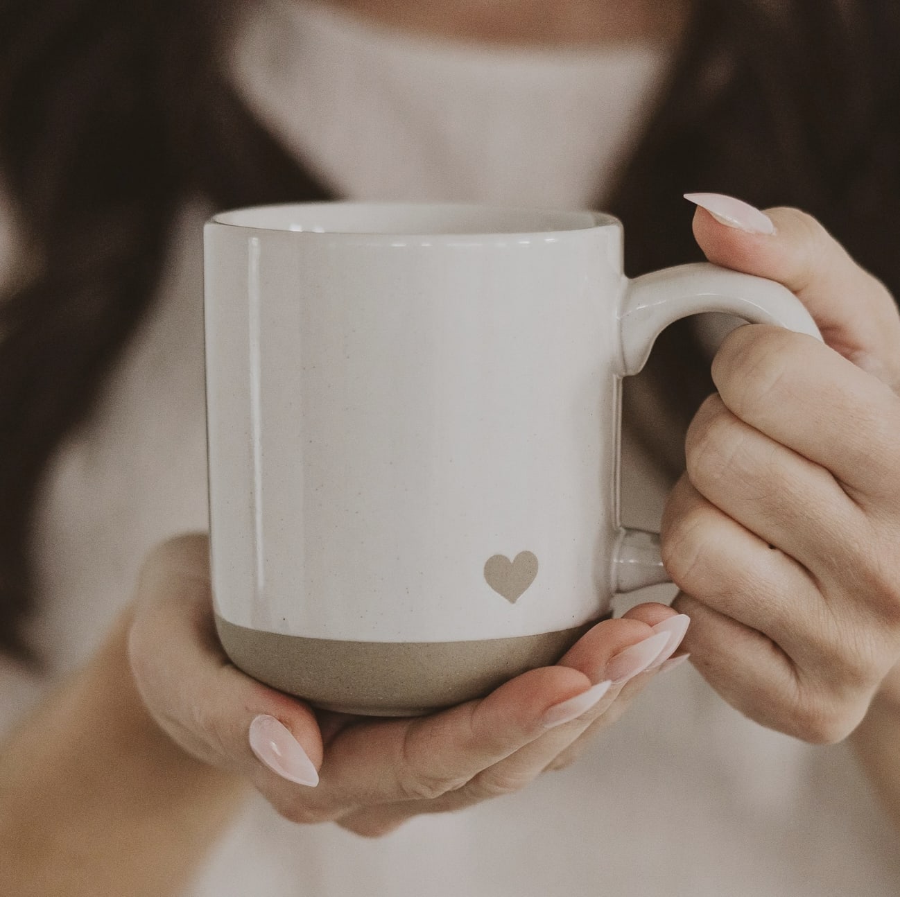 Heart Stoneware Coffee Mug - Perfect for everyday use or as a thoughtful gift for Valentine’s Day, Mother's Day, weddings, engagements, bridal showers, and anniversaries.  DETAILS:  • 14oz Cream Stoneware Style Mug • Size: 3.31 x 3.93" (5.19" w/handle) • Design: Natural Heart • Design on Both Sides of Mug • Speckled Design with Natural Bottom Details • Each piece is hand-crafted, making the character of each mug perfectly unique. There may be slight variations. • Designed in the USA, Imported  CARE:   • Microwave and Dishwasher Safe • Wash Before Use and Avoid Abrasive Cloths When Cleaning • Use Caution When Removing From Microwave