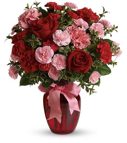 Dance with Me Bouquet with Red Roses - Turn up the heat on your relationship with this sizzling bouquet of carnations and roses in a sparkling glass vase. It makes a spectacular gift for anniversary or any loving occasion. A mix of carnations and roses in shades of red and light pink. Delivered in a glass vase accented with pink satin ribbon.Approximately 14" W x 16 1/2" H Orientation: One-Sided As Shown : TEV12-5ADeluxe : TEV12-5BPremium : TEV12-5C