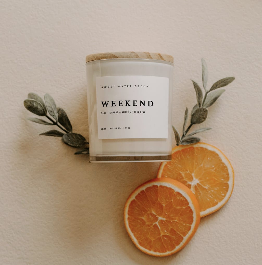 Weekend 11oz. Soy Candle - SCENT NOTES: • Top: Citrus, Grapefruit, Sage  • Middle: Lavender  • Base: Amber, Tonka Bean, Oakmoss  Gift someone this white jar candle that looks great in any space and is perfect for Spring, Summer, Housewarming - any time of the year!  CANDLE INFO: • Size: Volume 11oz | 214g Net Weight | 3x3x3.5" • Burn Time: 50+ Hours • Wick: 10% Cotton (Lead and Zinc Free) • Wax: Proprietary Soy Based Wax Blend | Vegan, Non-GMO, Kosher • Premium Fragrance Oil • Gluten Free, Phthalate Free, Non-Toxic • Made in Pittsburgh, PA