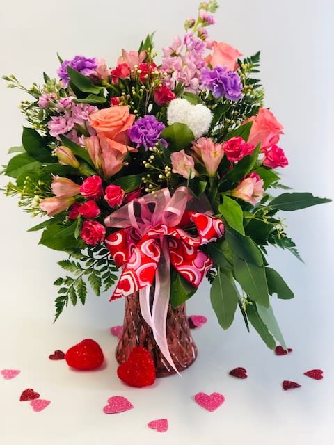 Be Mine - Pink, Lavender and peach tones finished off with Valentines Day bow! Mixed flower types and tones