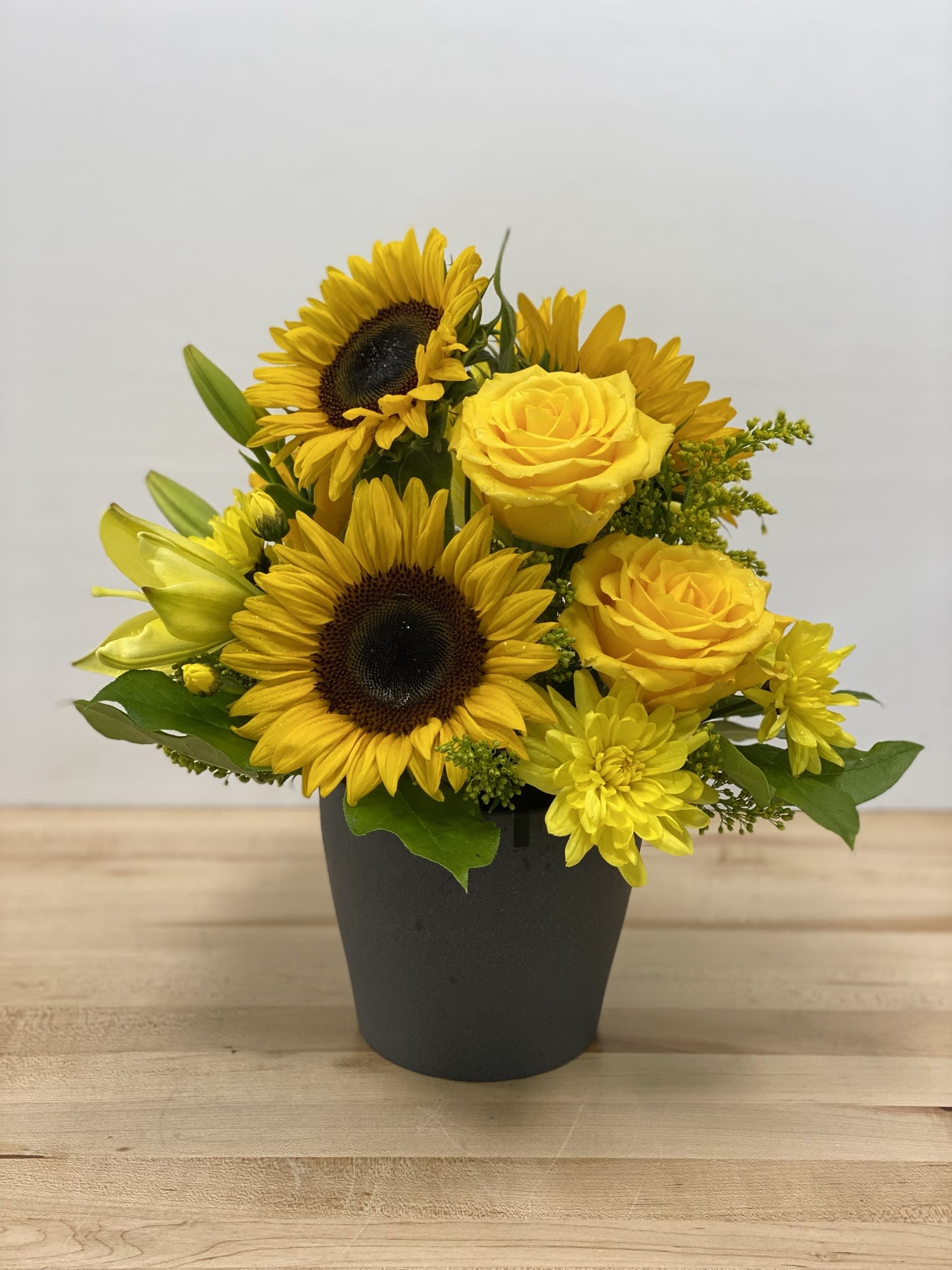 Sunshine  - This bright and cheerful arrangement will bring joy to any day! Monochromatic yellow flowers fit for everyone and every taste. 