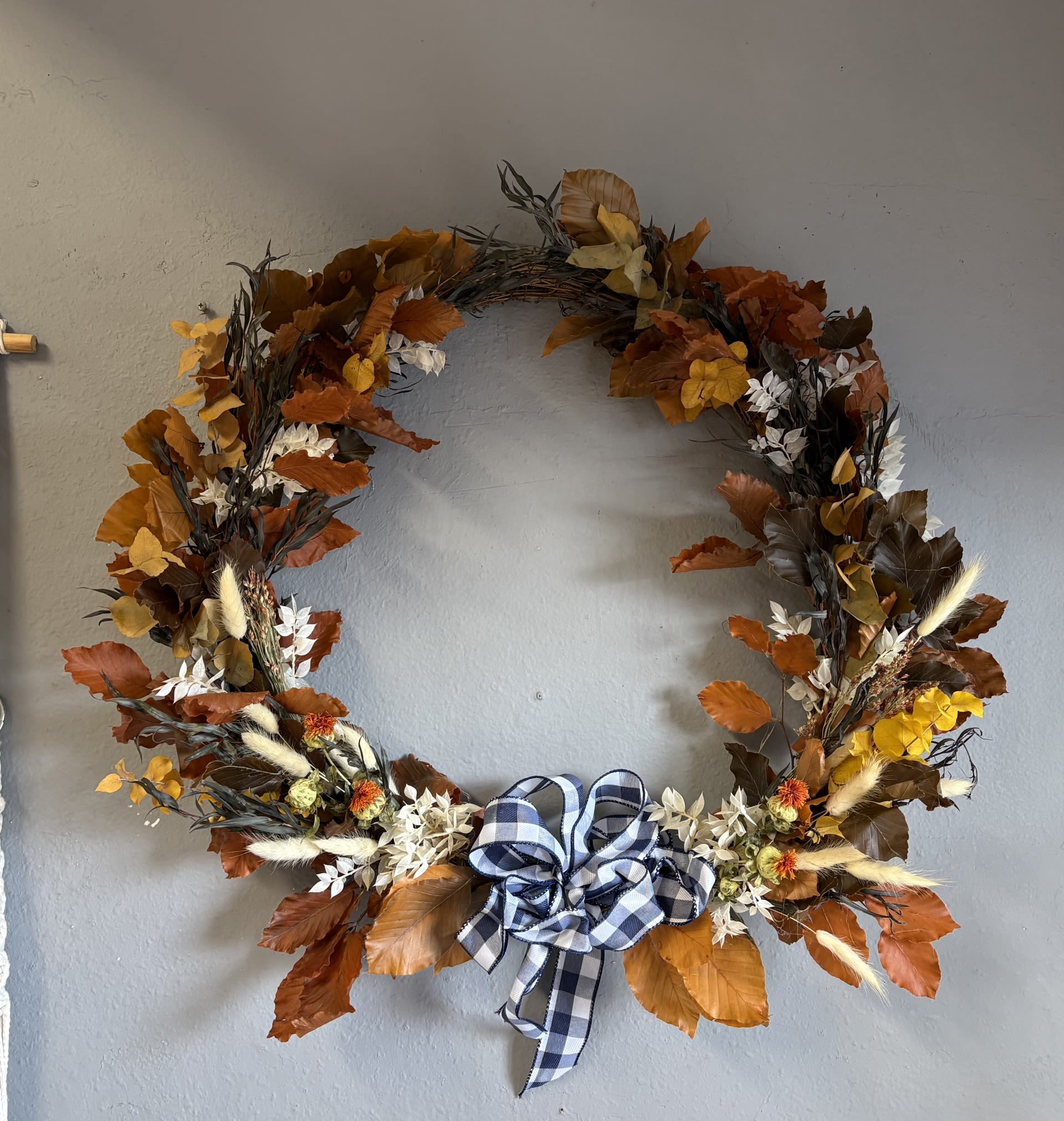 Large Holiday Wreath (creams and browns) - A beautifully decorated holiday wreath for the Autumn season. Accented with dried elements and a blue plaid ribbon. Just lovely.