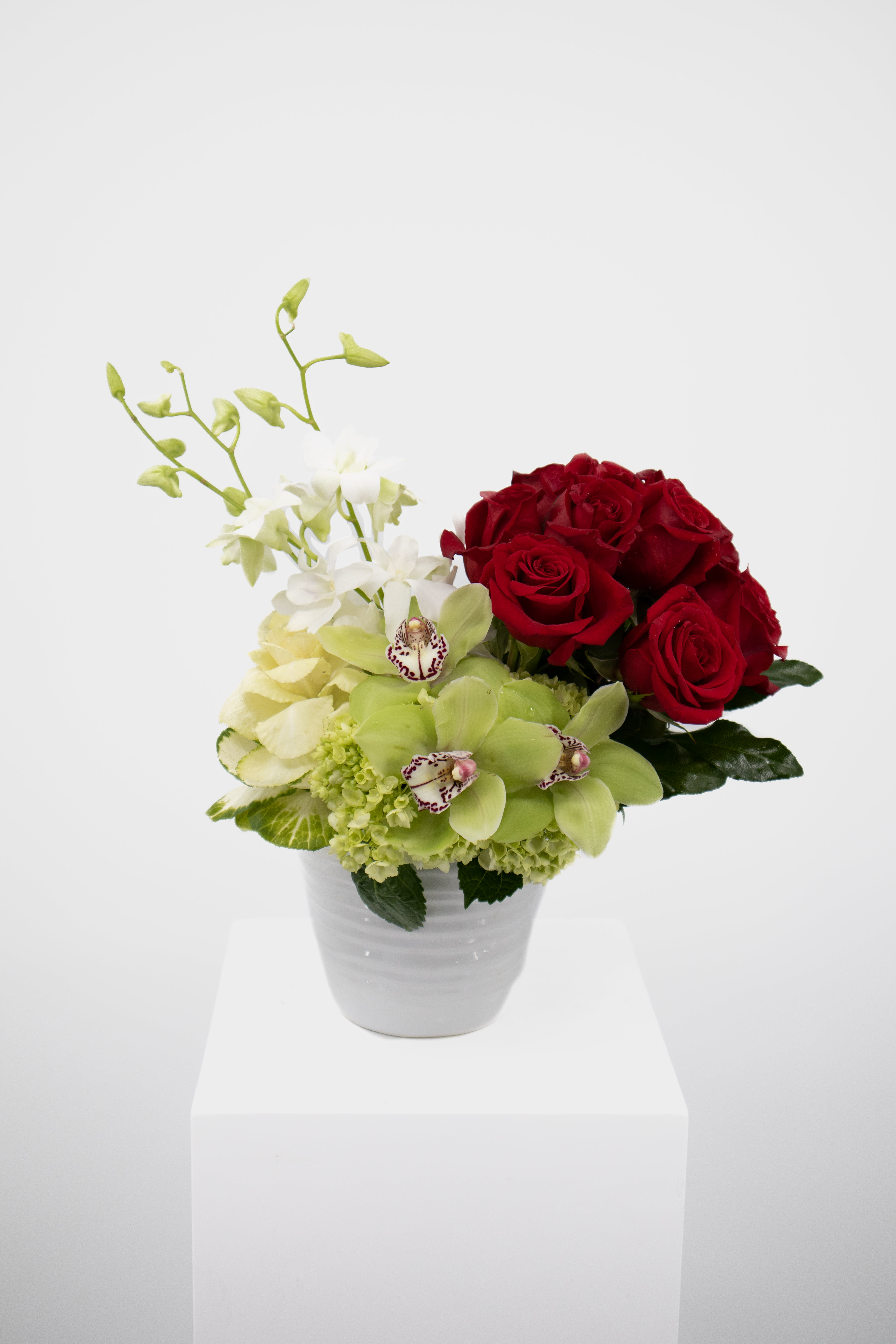 Carly  - This stunning array of orchids, hydrangeas &amp; roses will send the story of your love for that special someone with grace and ease.