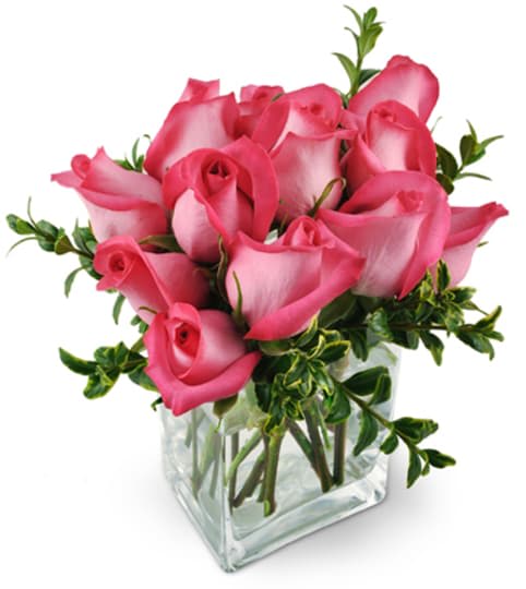 Pink Infatuation - This intoxicating arrangement is the perfect blend of sweet femininity and unabashed confidence! Our luxurious Pink Infatuation bouquet - consisting of a dozen hot pink roses - is sure to send that special someone straight to Cloud Nine!  Please note that your blooms will reflect the overall style and tone of the pictured arrangement. Exact flower types, colors and vase style may vary and are based on availability. 