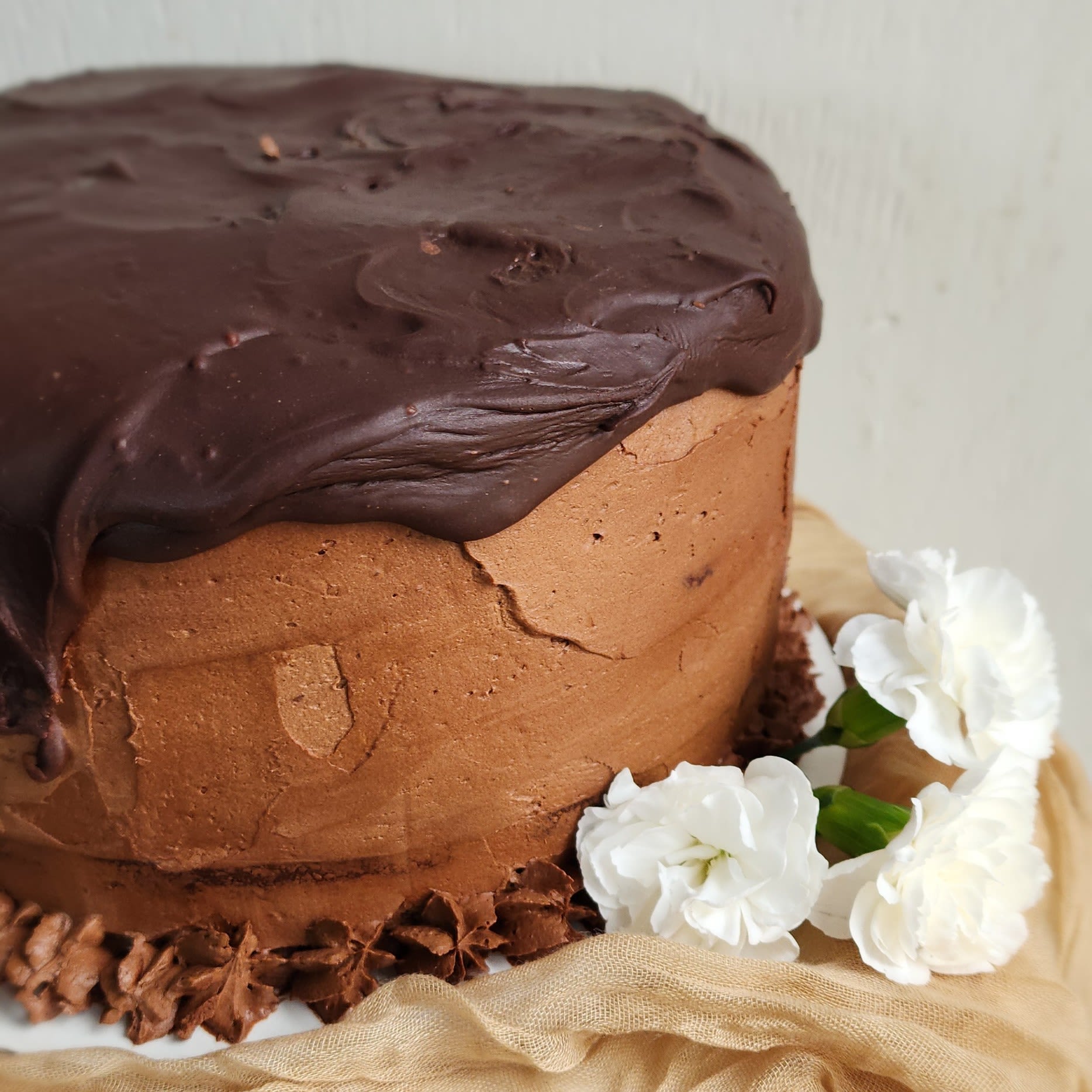  Whole Chocolate Cake  - Scrumptious chocolatey goodness.  The whole cake should feed 24 people. Dimensions 5 h x 9 w and it is three layers!  If at first you don't succeed, eat cake! Or send one to your friend/sister with some flowers on the side to brighten and cheer up the day!