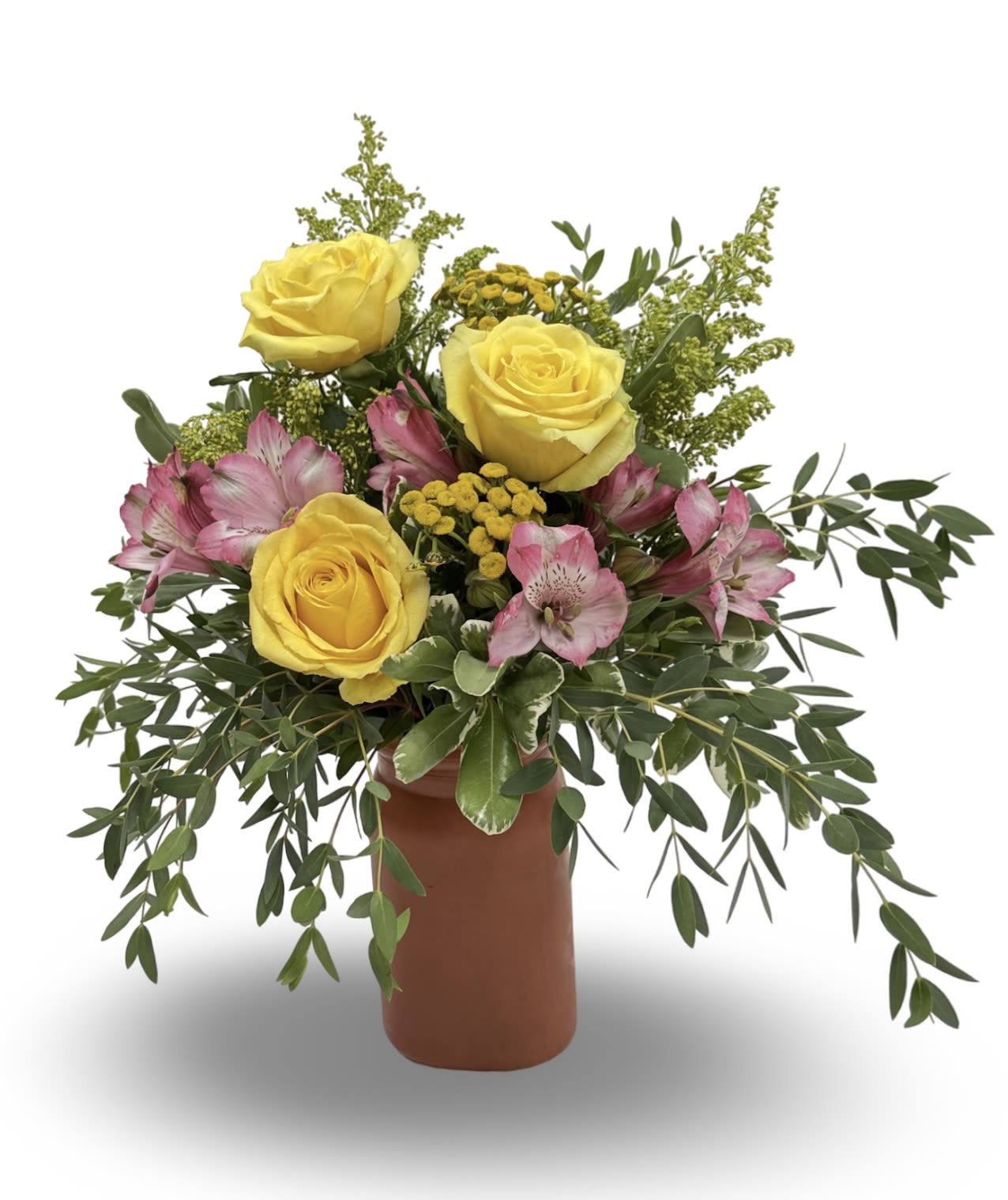 Sunkissed Punch - Brighten any space with Sun-Kissed Punch, a cheerful mix of vibrant yellow roses, playful pink alstroemeria, and sunny golden button flowers. Fresh greenery adds fullness and texture, all arranged in a modern orange vase with a matte finish. Perfect for birthdays, celebrations, or simply bringing a little sunshine to someone’s day.  Approximately 16” h x 14” w