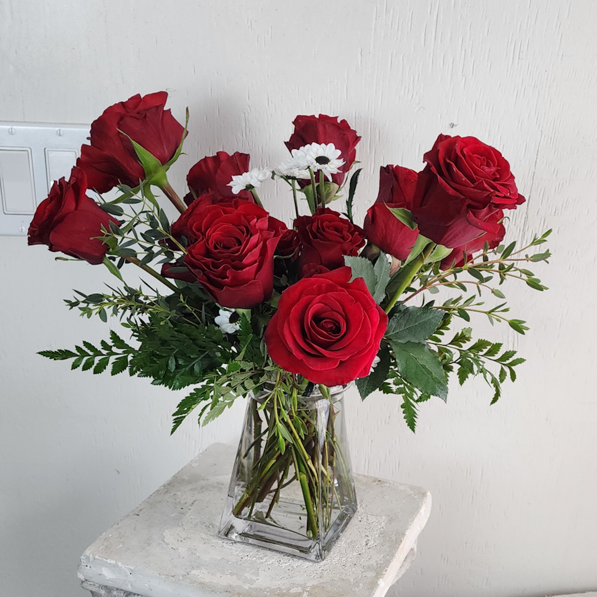 Heart A Flame ( Dozen  Red Roses) - We are a small studio florist in a small town. Every bouquet we create is a one-of-a-kind creation, tailored to the season, availability of flowers, color choice, artistic interpretation, and the current materials available. The photos do not represent the exact flowers that will be delivered. They are intended to provide you with an idea of what we do, how we do it, and the variance that can be expected.The season, availability of flowers, color choice, artistic interpretation, and the current materials available. The photos do not represent the exact flowers that will be delivered. They are intended to provide you with an idea of what we do, how we do it, and the variance that can be expected.