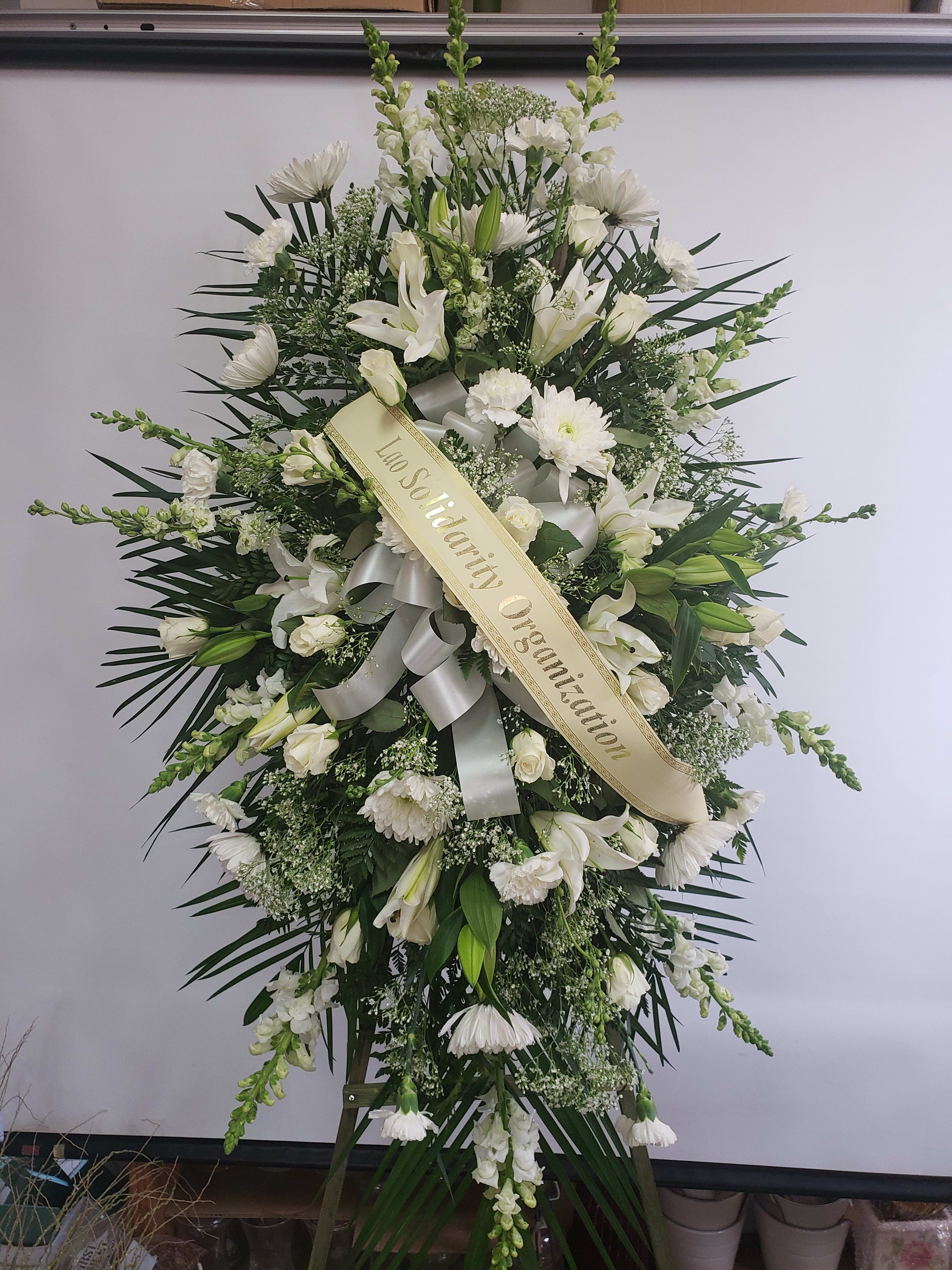 Sympathy Standing Spray #35 - Standing spray of fresh cut flowers. Designed on an easel which is included with arrangement and does NOT need to be returned. Banner is included with arrangement. Please specify what is to be printed on banner upon check out under "FLORIST INSTRUCTIONS". LIMITED TO 5 WORDS ON BANNER.