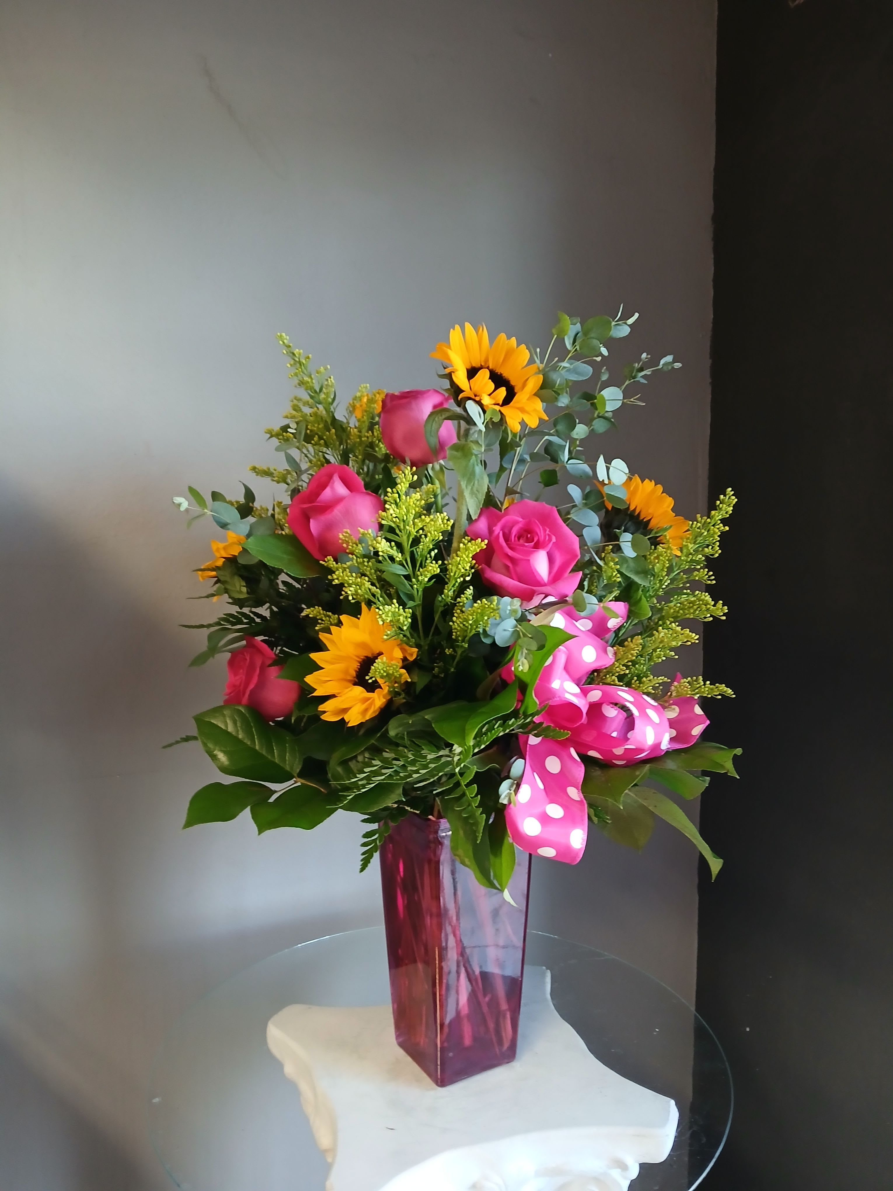 # 153 Single Stem White Orchid  - A beautiful winter arrangement of Pinks and lavender's with an accent of gold and silver perfect for that winter birthday or New Year's party!.