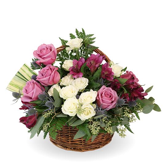 My Affections - A sweet, elegant basket arrangement featuring lavender roses, creamy white spray roses, and rich magenta blooms (like alstroemeria), accented with blue thistle and lush greenery. Designed in a classic woven handle basket—perfect for sending love, gratitude, or warm wishes.