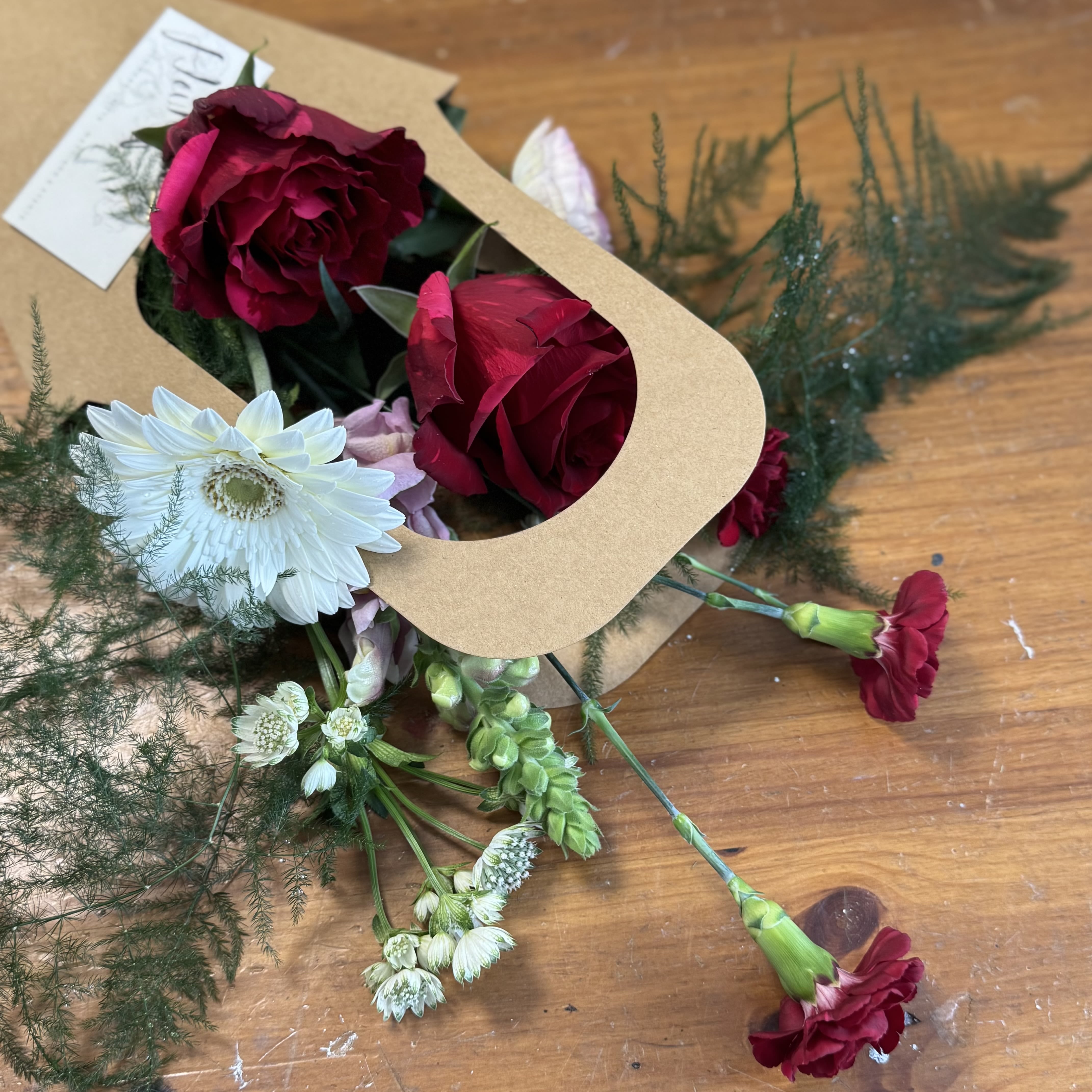 (Valentine's Day) I Adore You Mini Bouquet - PICKUP ONLY - A sweet, easy way to share some love this Valentine’s Day. Our mini loose-wrap bouquets are perfect for grab-and-go gifting and feature a simple, seasonal mix of fresh blooms.  Each one is hand-tied and wrapped with care- thoughtful without being over the top. Great for partners, friends, Galentines, or a just-because surprise. If you have a color or flower preference, feel free to note it at checkout and we’ll do our best to make it happen.  Available for pick up only.