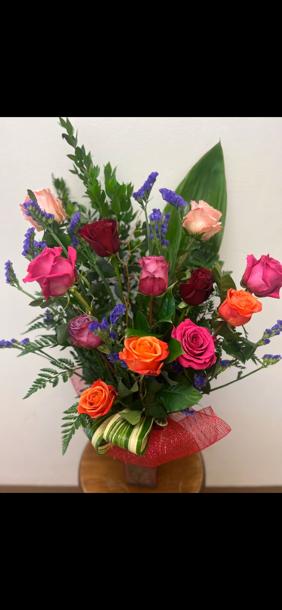 Colors of Love Dozen Roses: Multicolor  - Get our freshest variety of colored roses designed in a vase. 