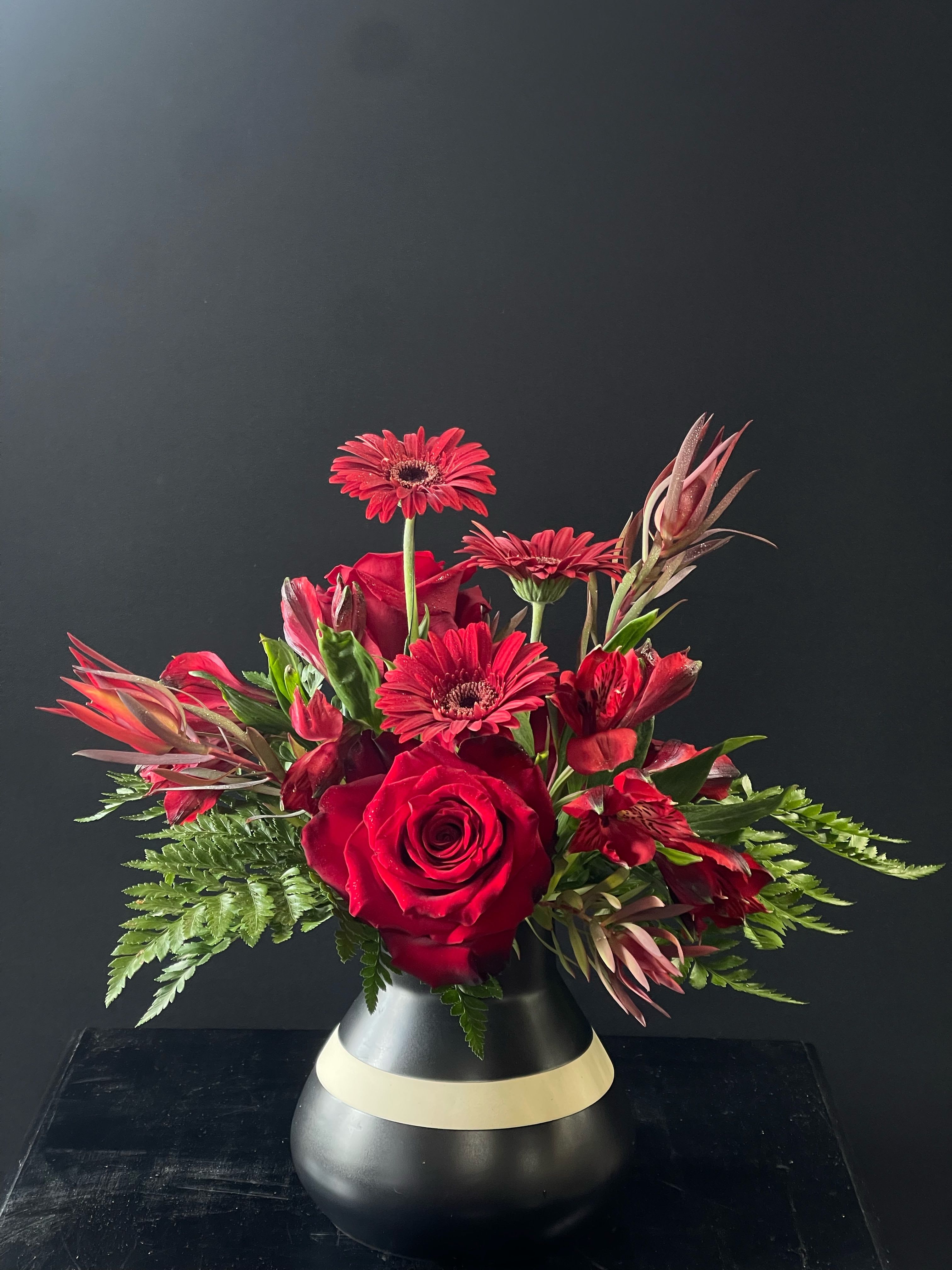 Date Night - All red flowers like roses, alstroemeria, mini gerbera, and more, in a beautiful black and white vase
