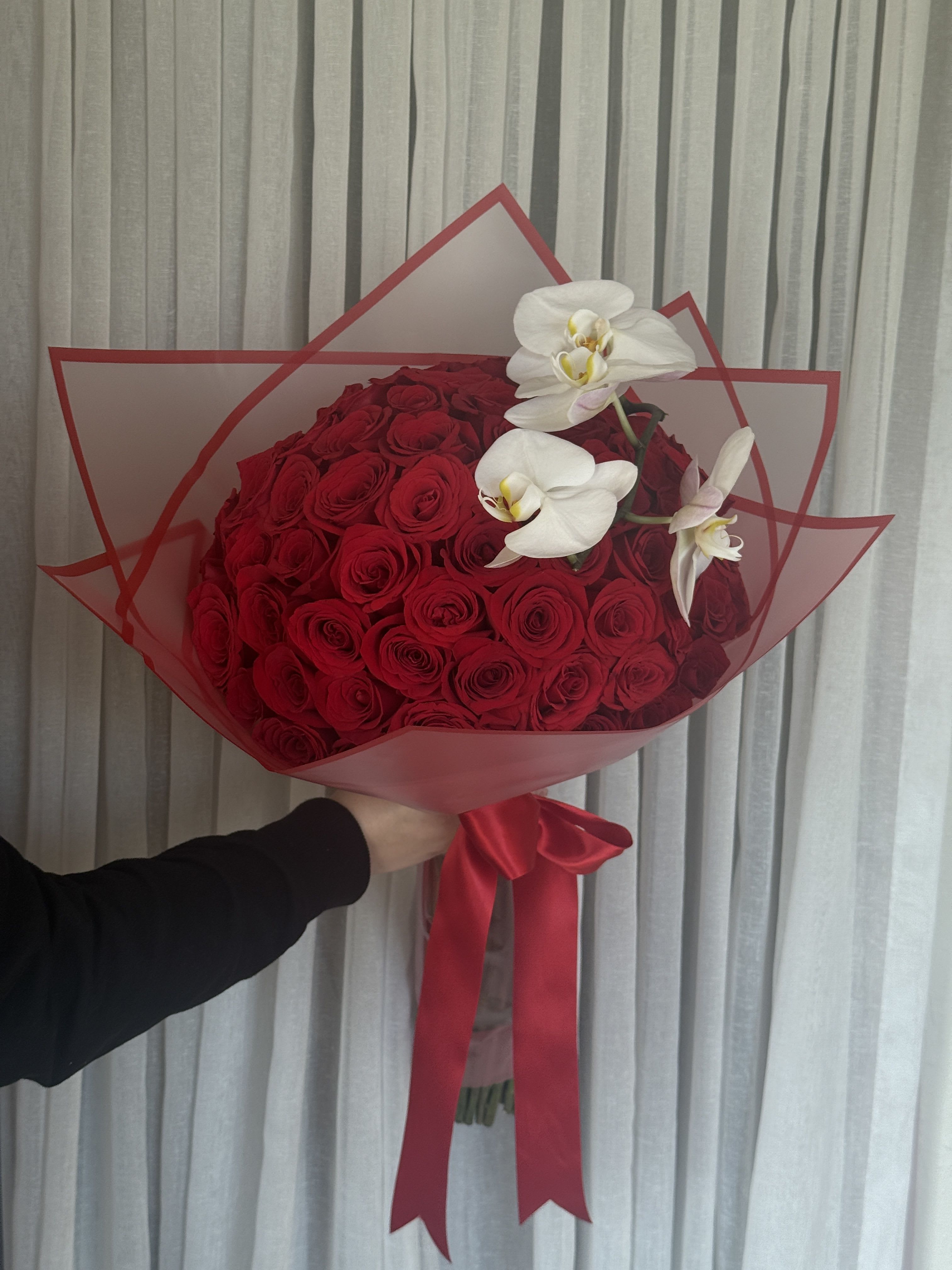 75 Rose Wrapped Bouquet - With Orchid - 75 roses carefully wrapped and tied with a satin ribbon. Orchid add on for a unique romantix touch