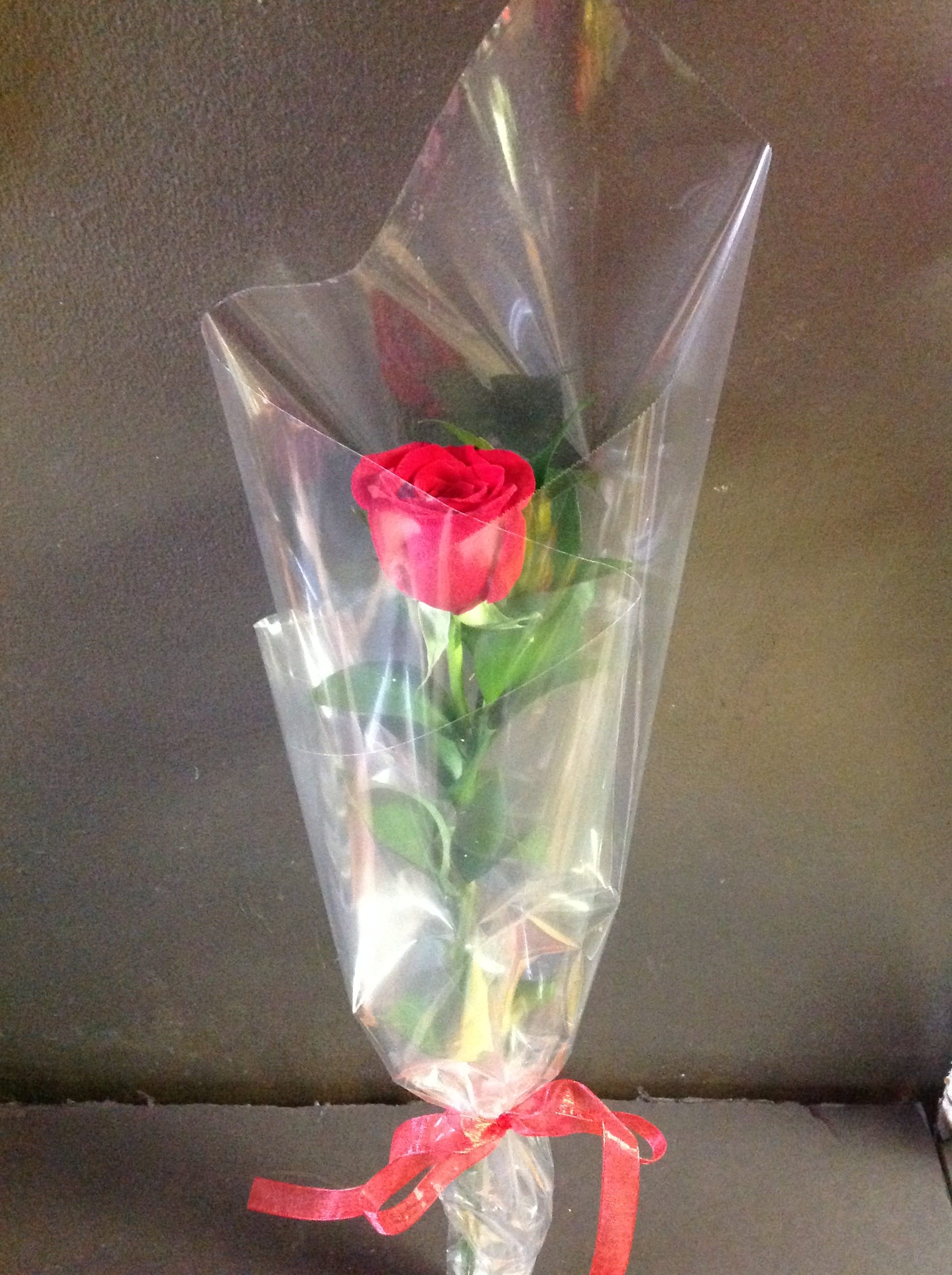 Single Red Rose - PICKUP ONLY - 1 red rose wrapped with a ribbon. Available as a pick up option only.   Available February 9 - 14th