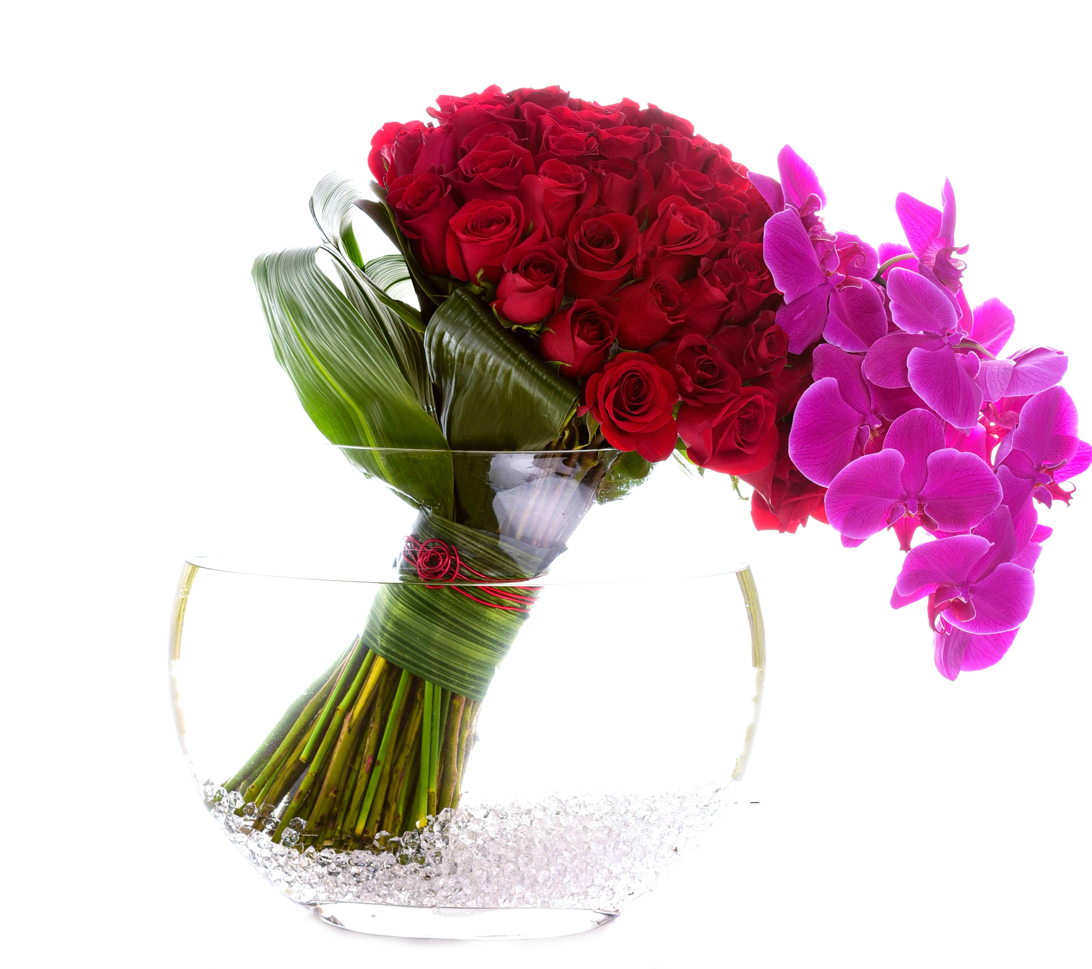 Love Burst   - 75 Stunning red roses with purple phalaenopsis orchid stems, perfect for the one you love. 
