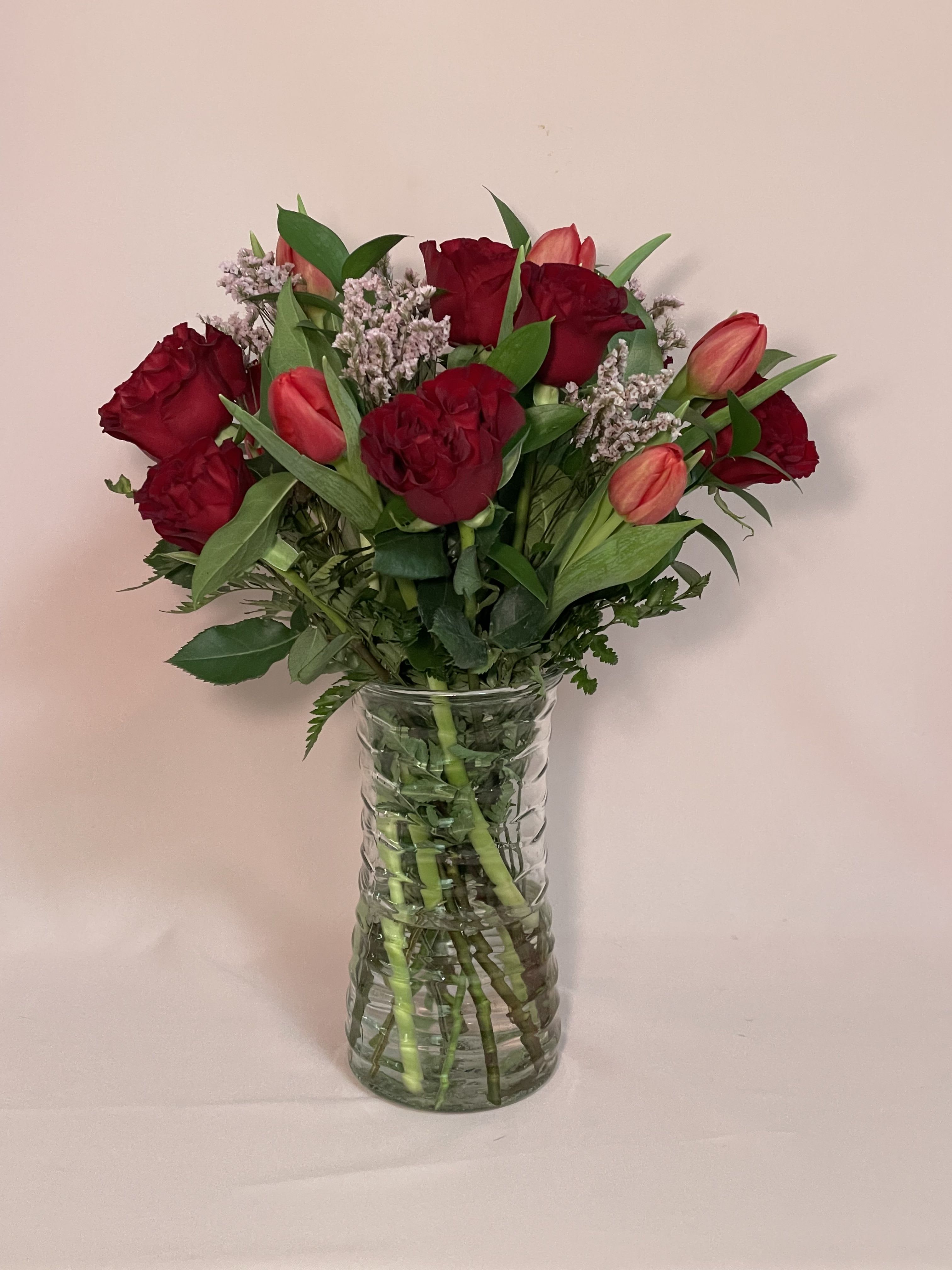 Red Romance - Garden Roses, tulips, seasonal greens and limonium.