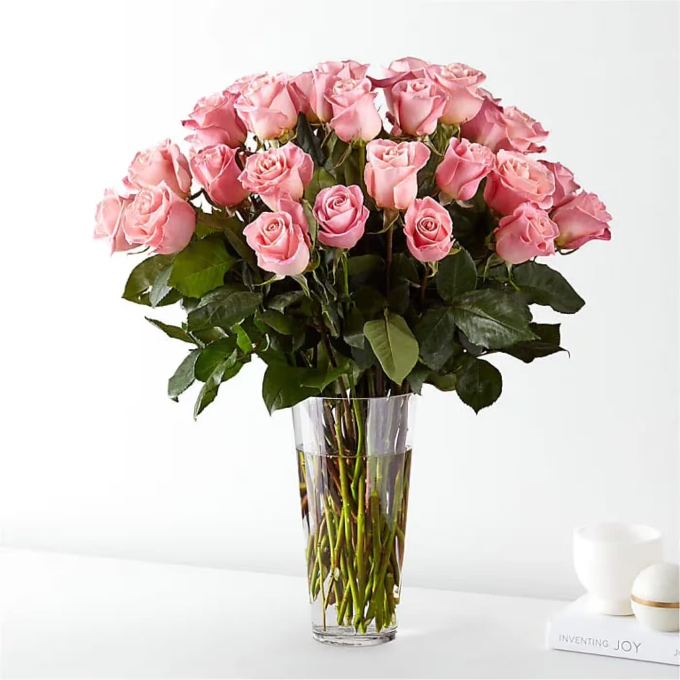 3 Dozen Long Stemmed Pink Roses - Here’s the revised version for Flower Synergy, with a refined, romantic tone that feels elevated and on brand:  ⸻  Step into a moment of soft romance with Flower Synergy’s timeless pink rose arrangement, designed for those who appreciate classic beauty and heartfelt elegance. This stunning bouquet features three dozen premium pink roses, each bloom radiating warmth, grace, and understated luxury.  Thirty-six blush pink roses come together in a lush, full design, their delicate petals symbolizing love, gratitude, and admiration. Hand-selected for their quality and longevity, these premium roses are thoughtfully arranged by the designers at Flower Synergy to create a look that is both romantic and refined. Whether celebrating a meaningful milestone, expressing appreciation, or simply sending a thoughtful gesture, this arrangement speaks beautifully without saying a word.  Pink roses are cherished for their gentle charm and timeless appeal. Their soft hue conveys affection and sincerity, making them perfect for a wide range of occasions. With three dozen roses, this bouquet makes a generous and lasting impression, offering beauty that continues to be enjoyed for days to come. Crafted with care and delivered fresh, this Flower Synergy design is a true expression of elegant sentiment.