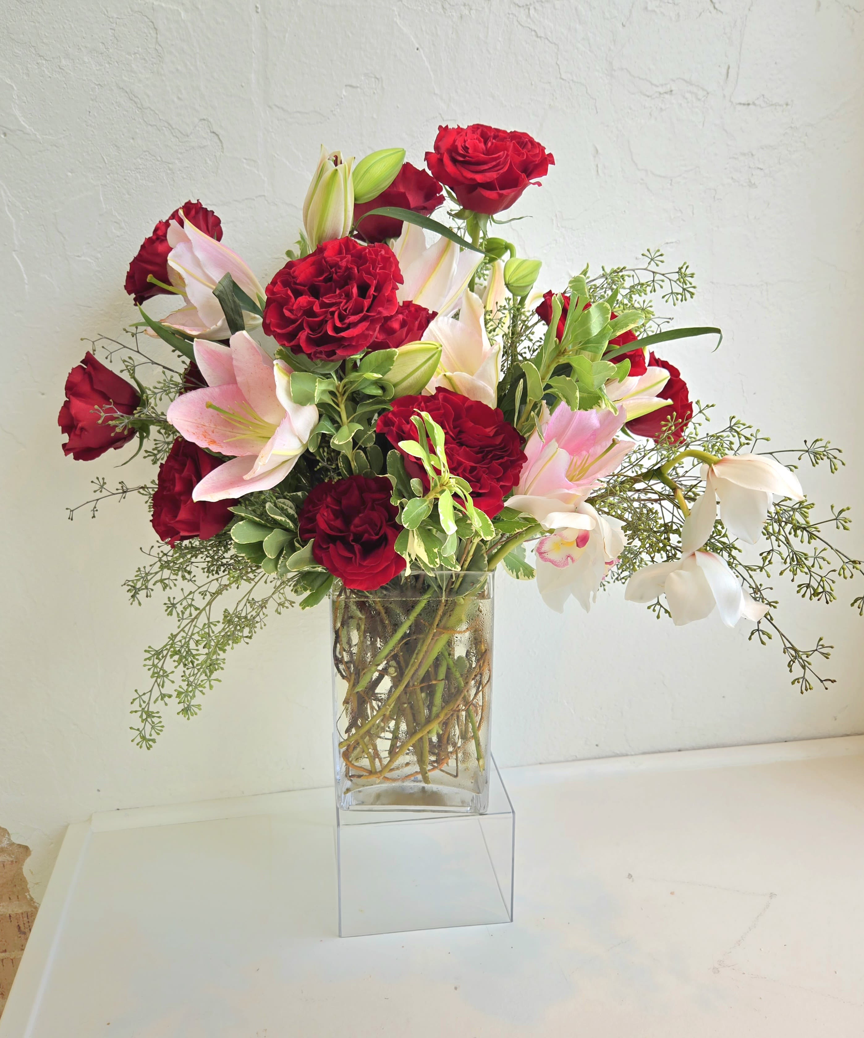 "Luxe" custom design by The Impeccable Poppy - 12 gorgeous heart roses with pink oriental lilies and a stem of gorgeous cymbidium orchids.  Garden style luxe for any special occasion...or just because. 