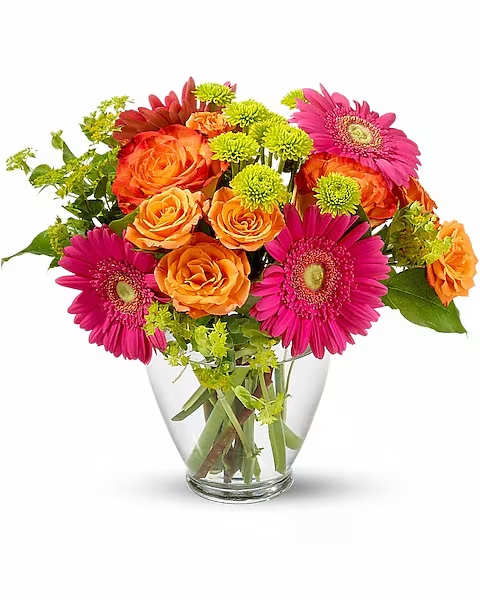 End Of The Rainbow - Hot fun in the summertime is here, and it's flowerific to be sure! This beautiful bouquet brings together a rainbow of the season's brightest blossoms.  Hot pink gerberas, orange bi-color roses, orange spray roses and green button spray chrysanthemums are delivered in a charming glass vase.  Approximately 8" W x 12" H    Orientation : All-Around  All prices in USD ($)  Due to an increase in the cost of roses, some product prices may be impacted during the Valentine’s delivery period.