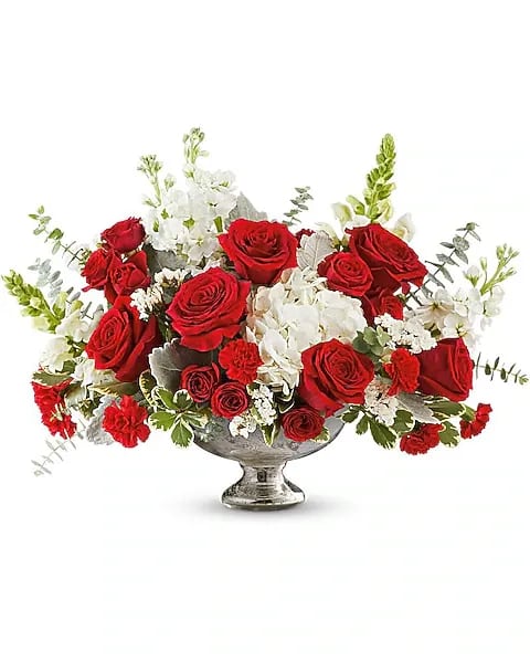 Sparkle Bouquet - A radiant expression of love, the Starlight Sparkle Bouquet glows with red and white blooms beautifully arranged in a gleaming mercury glass bowl that captures the magic of a starry evening.  The Starlight Sparkle Bouquet includes white hydrangea, red roses, red spray roses, red carnations, white snapdragons, white stock, and white sinuata statice, complemented by spiral eucalyptus, dusty miller, and variegated pittosporum