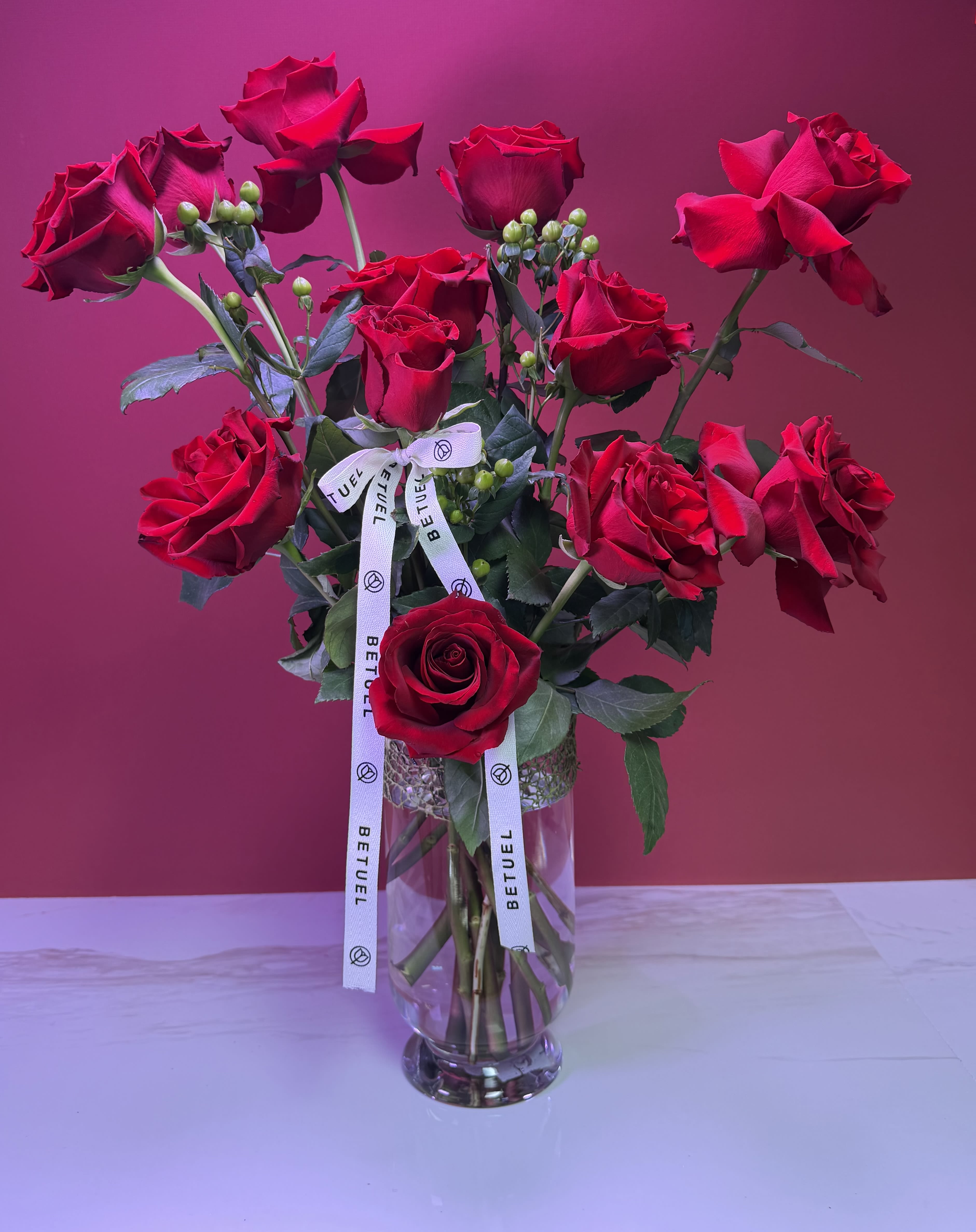 ‘LOVE AND PASSION’  Dozen Long Stemmed Red Roses  - These dozen red roses with baby's breath are classic! Perfect romantic gift for Valentine's Day or an Anniversary.   APPROXIMATE DIMENSIONS: 25" H X 18" W