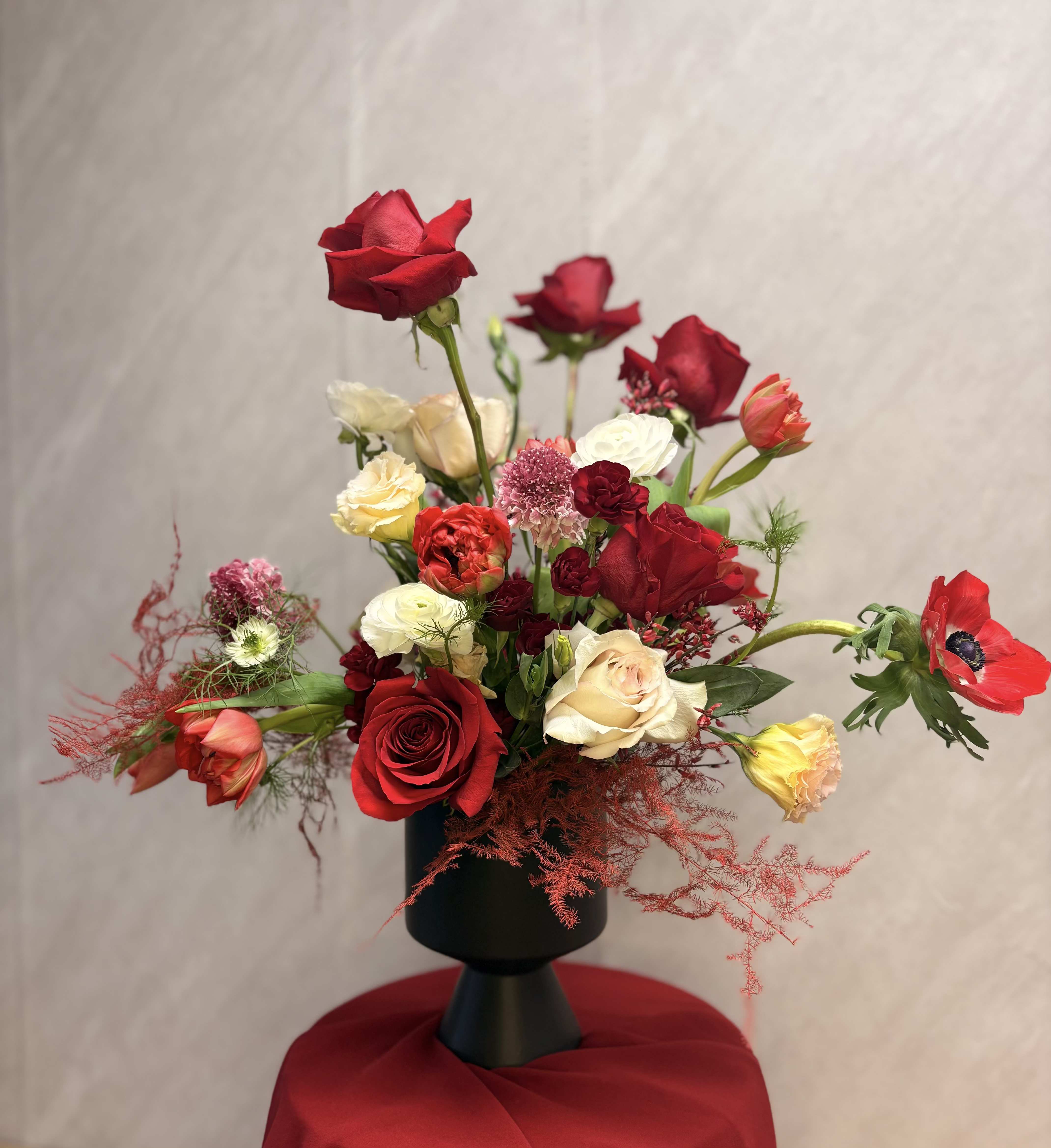 Hot for You - This is giving all the Valentine's true love vibes. Created with all shades of red and white this sultry arrangement is sure to impress.***flower selection will vary based of seasonality and availability ***